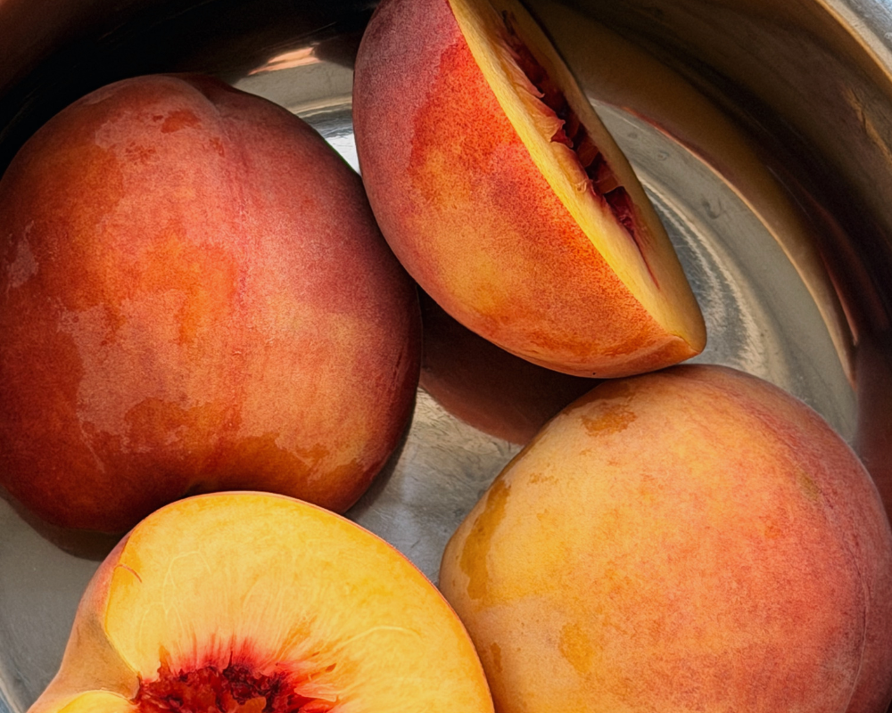  Yellow peaches in a saucepan to make Honey poached peaches 