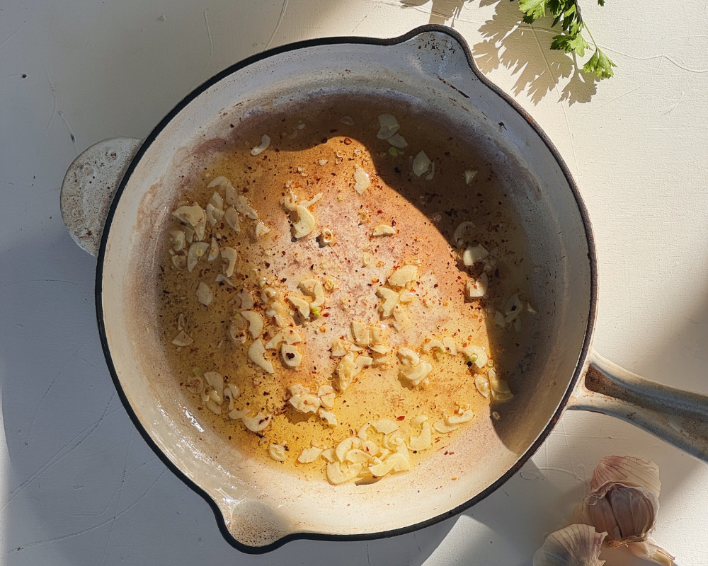  Garlic sizzling and turning golden in olive oil 