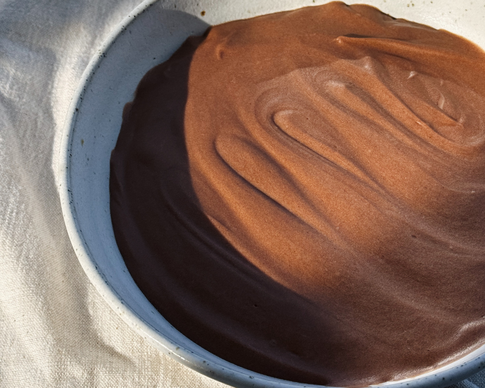  Hazelnut chocolate mousse in a speckled ceramic bowl 