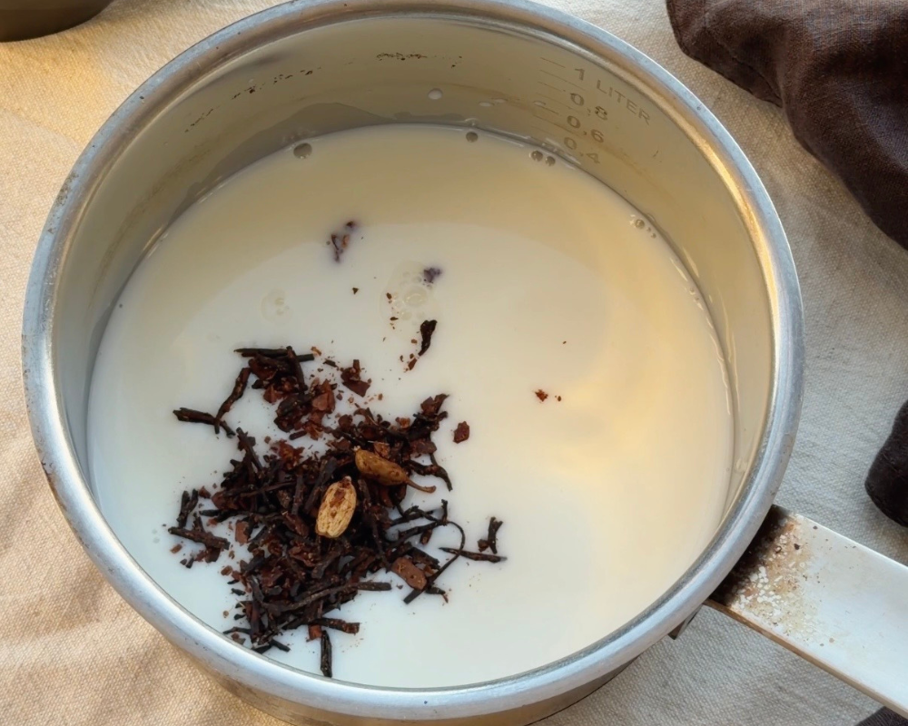 Chai mix being infused in warm milk for Chai Hot Chocolate 