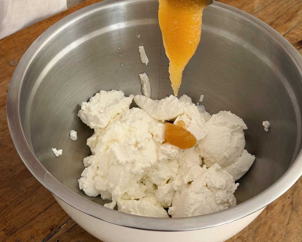  Drizzling honey into ricotta and goat's cheese filling for a no-bake apricot tart 