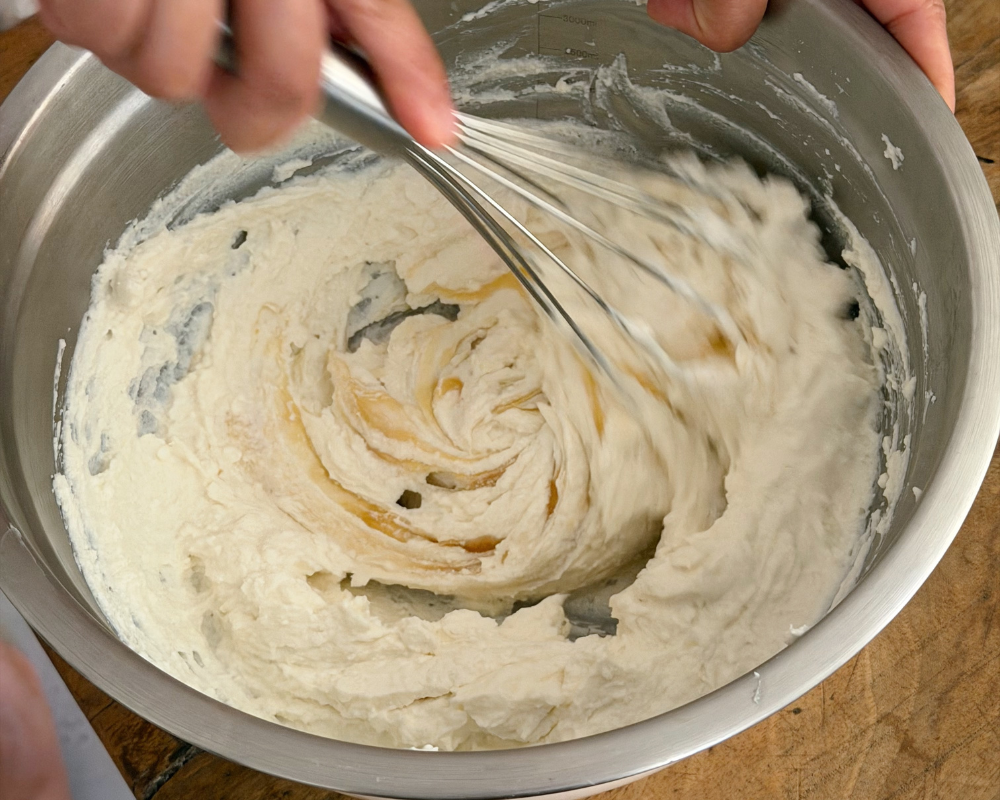  Whisking ricotta and goat's cheese together until light and fluffy for a no-bake tart 