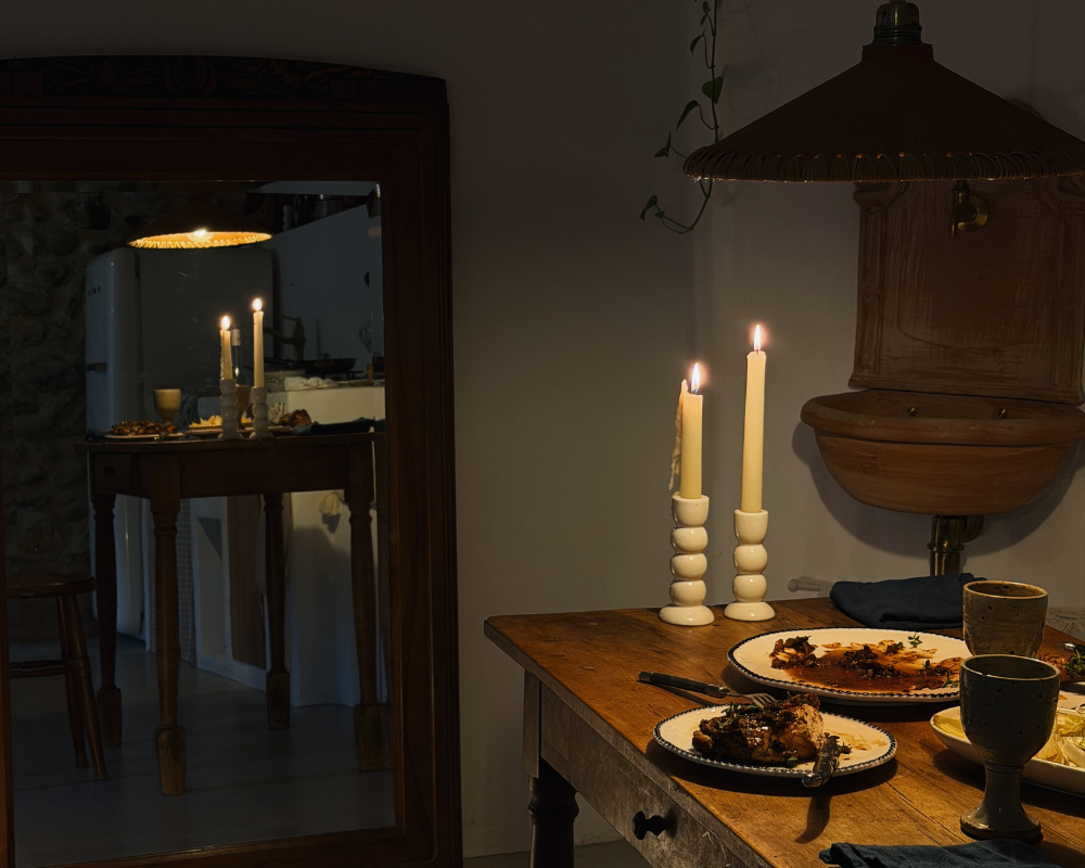  Candlelit dinner table set with local dishes at Maison Santcha 