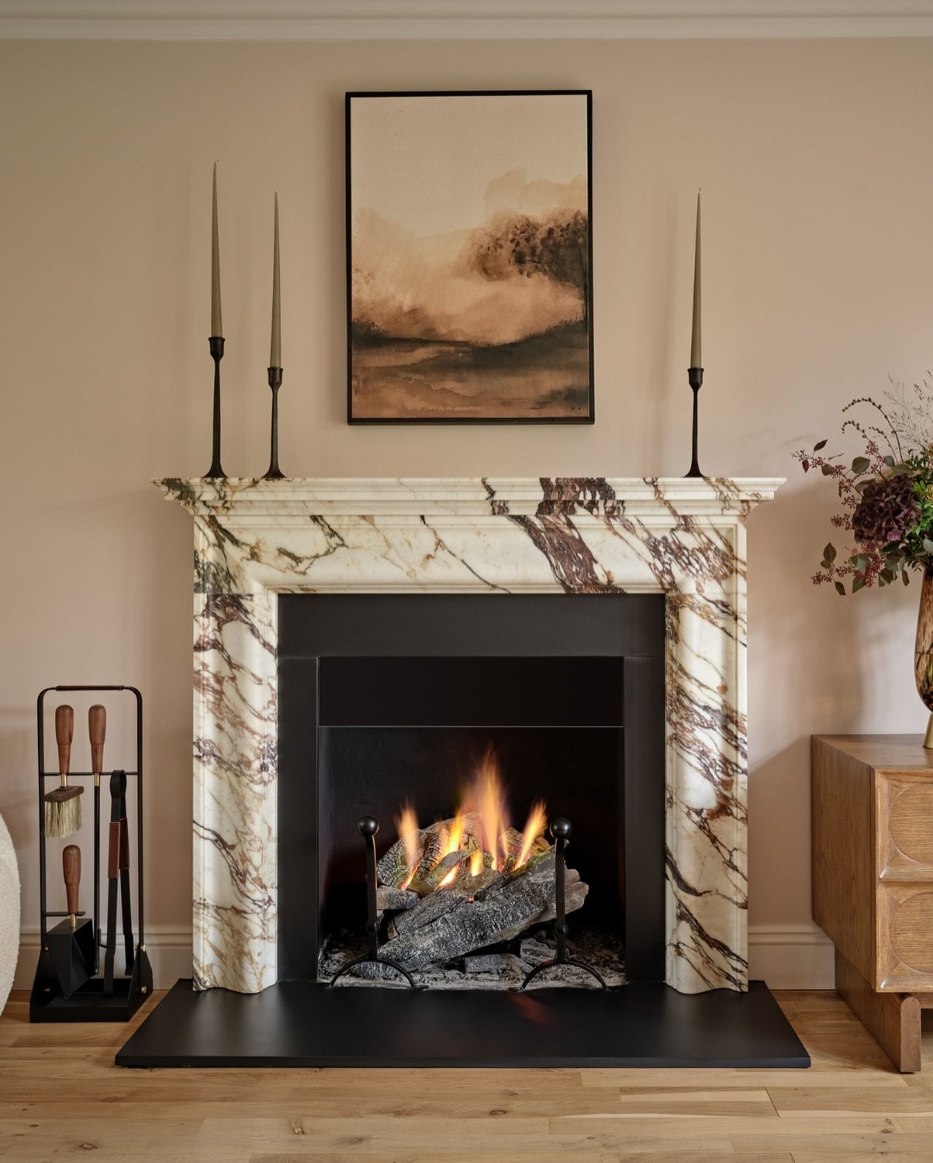 A fireplace brings a rare sense of calm to the home, a quiet ritual of warmth and stillness.

Its gentle glow softens the space, grounding even the most expansive interiors with intimacy and ease.

For those who design and curate with intention, it&r
