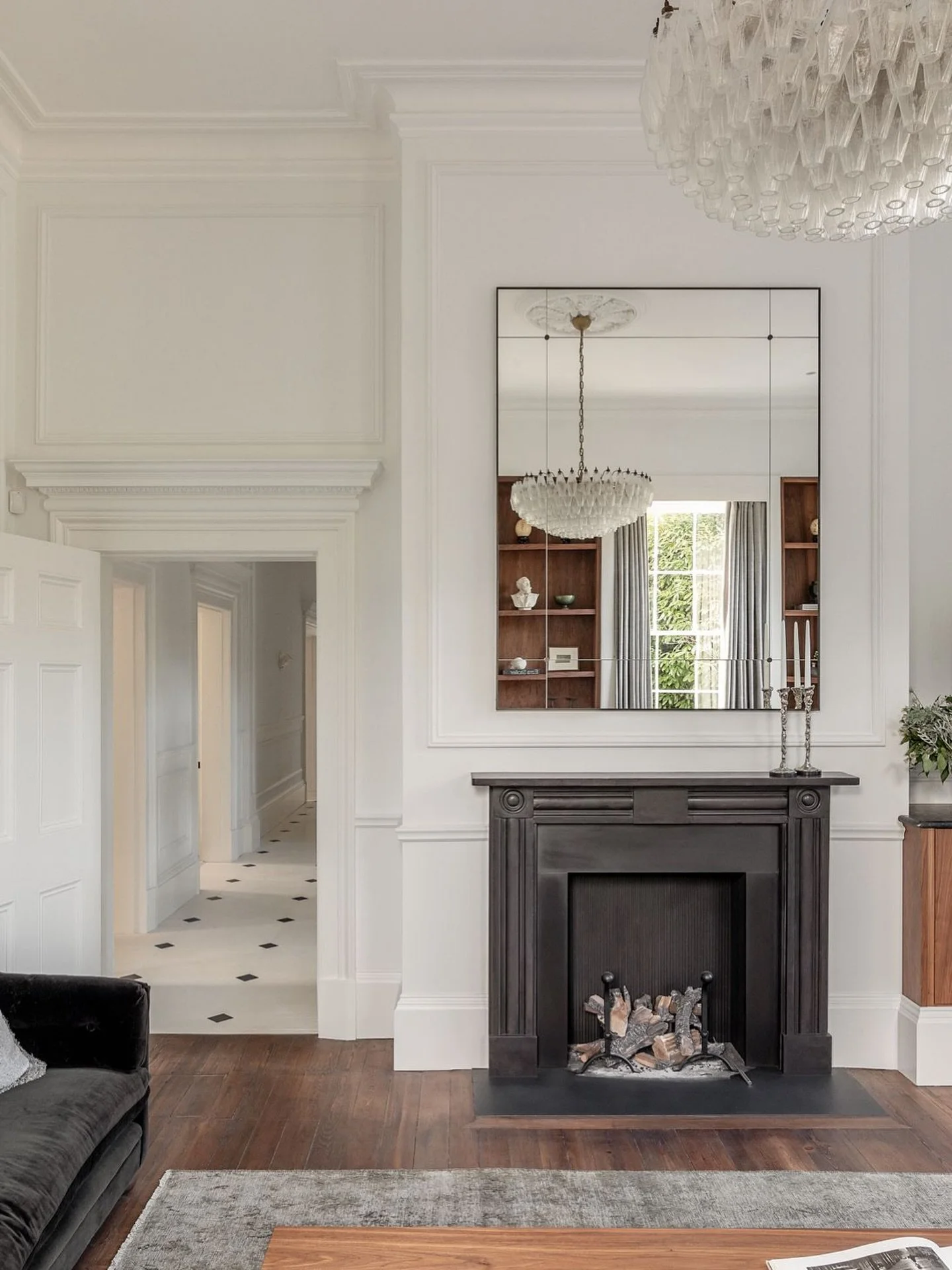 Dark doesn&rsquo;t have to dominate, it can help define.

This dark and layered fireplace anchors the room with quiet confidence, proving that even within a light, airy interior scheme there&rsquo;s space for contrast. 

In high-end interiors, it&rsq