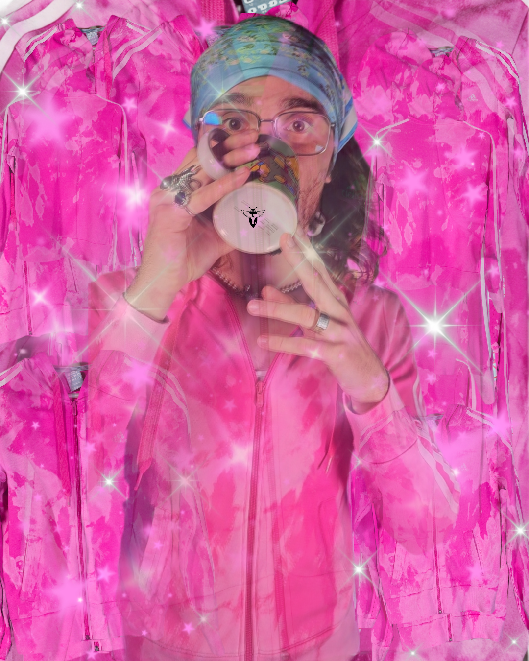 Person in pink jacket and tie-dye headscarf drinking from a mug with sparkles and pink backgrounds.