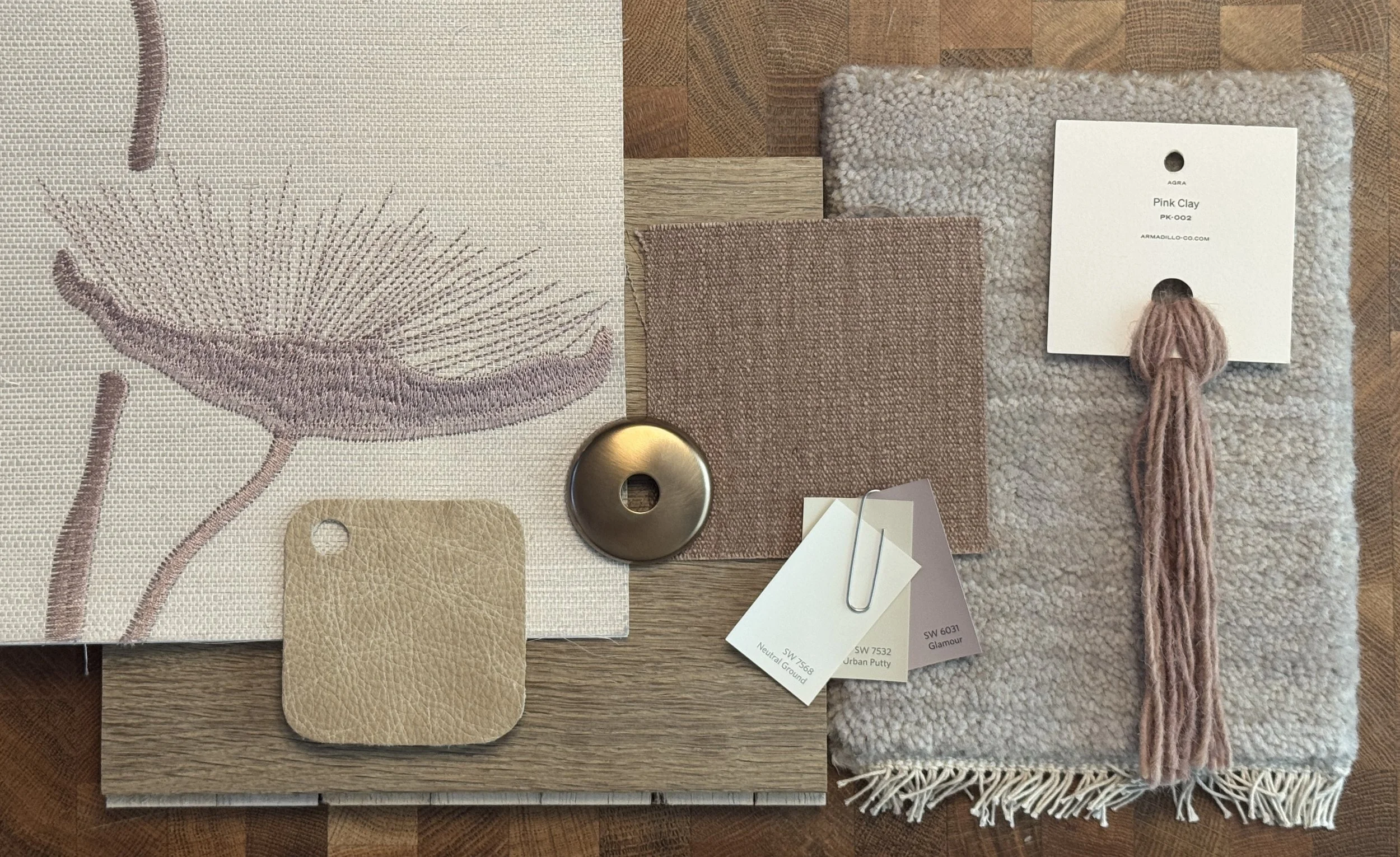 Material samples in desaturated lilac, beige, brass and cream.