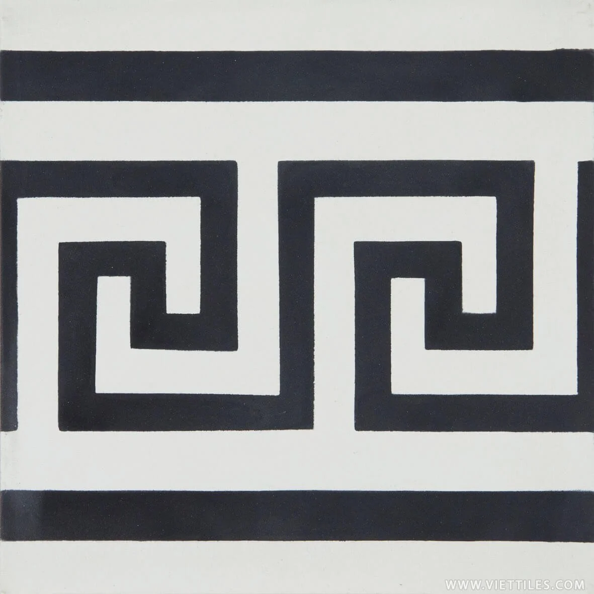 Black and white geometric tile pattern with squares and spirals.