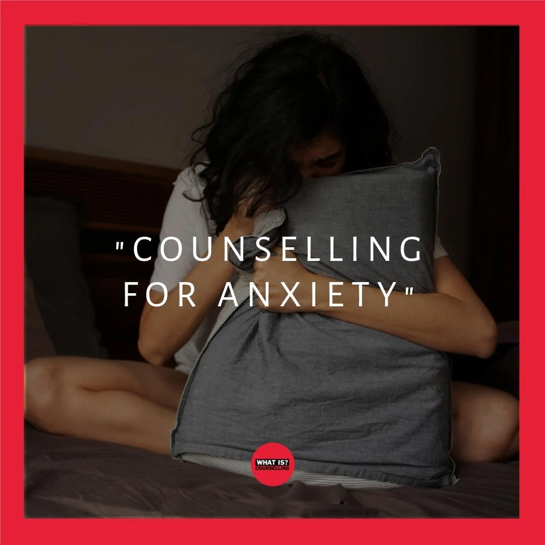 An image of someone clutching and hiding behind a cushion