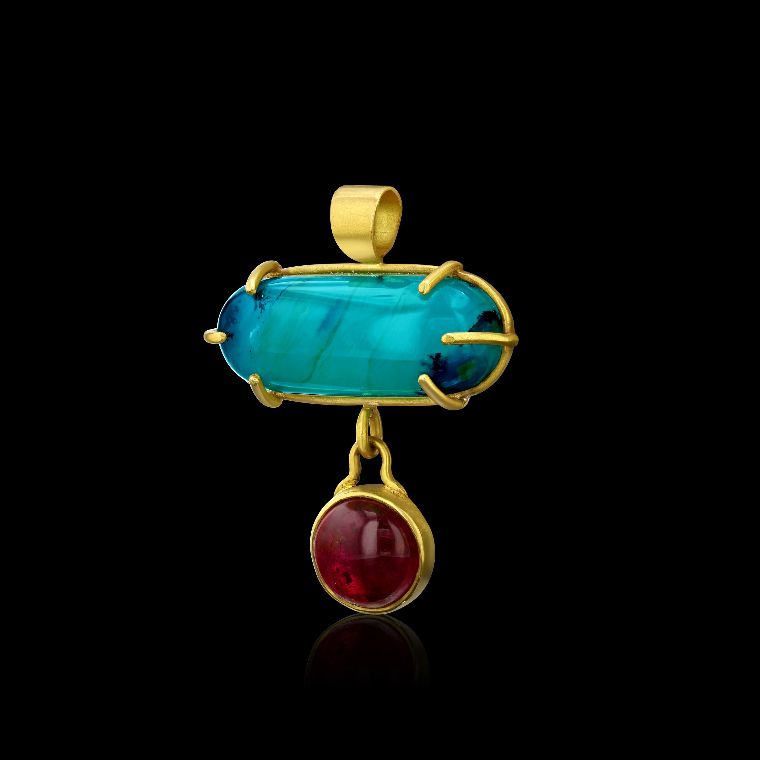 side view of a gold pendant with oblong veined Peruvian blue opal and a round pink tourmaline hanging beneath it