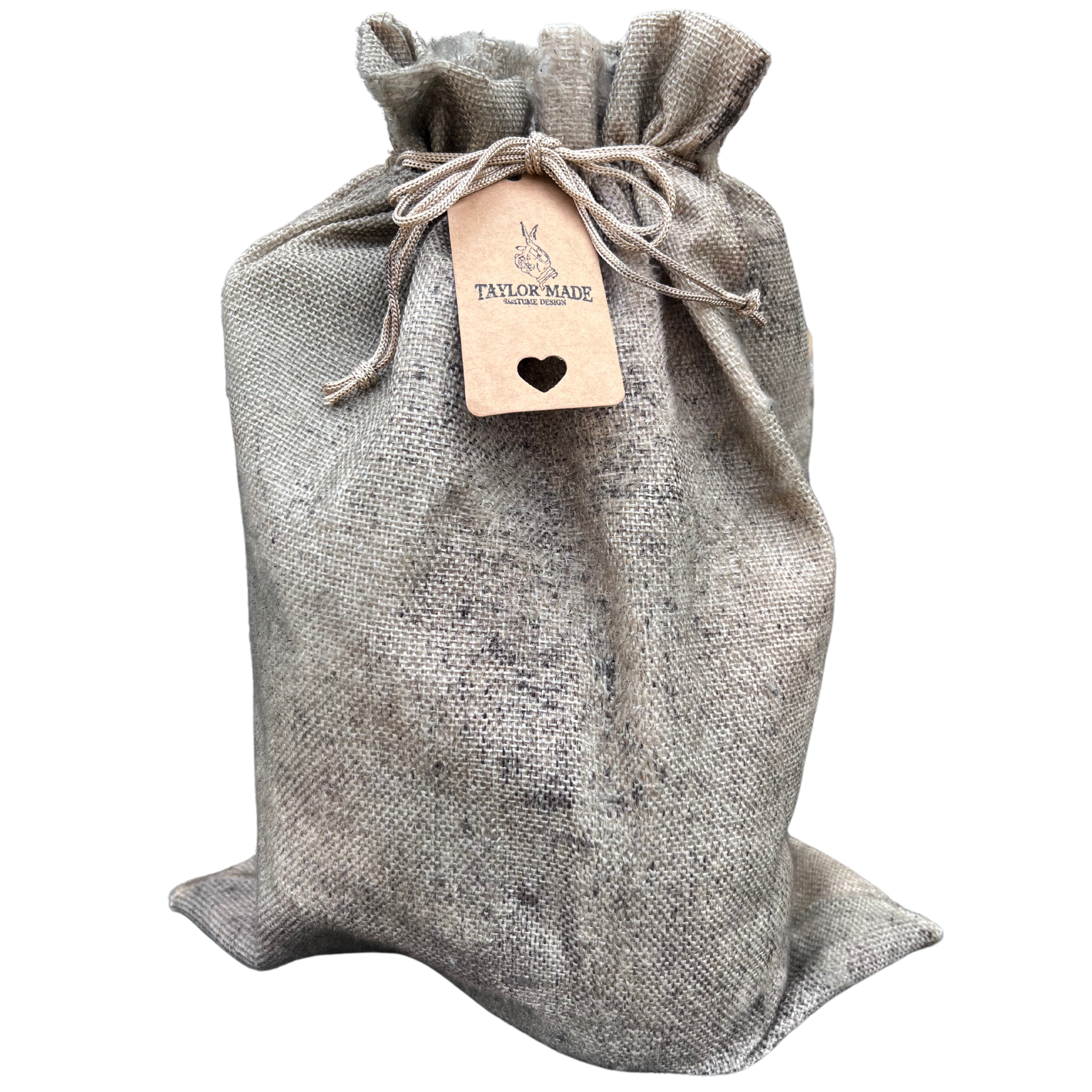 A cloth bag with a drawstring closure, made of beige textured fabric, featuring a tag with the brand name "Taylor Made" and a small heart symbol.