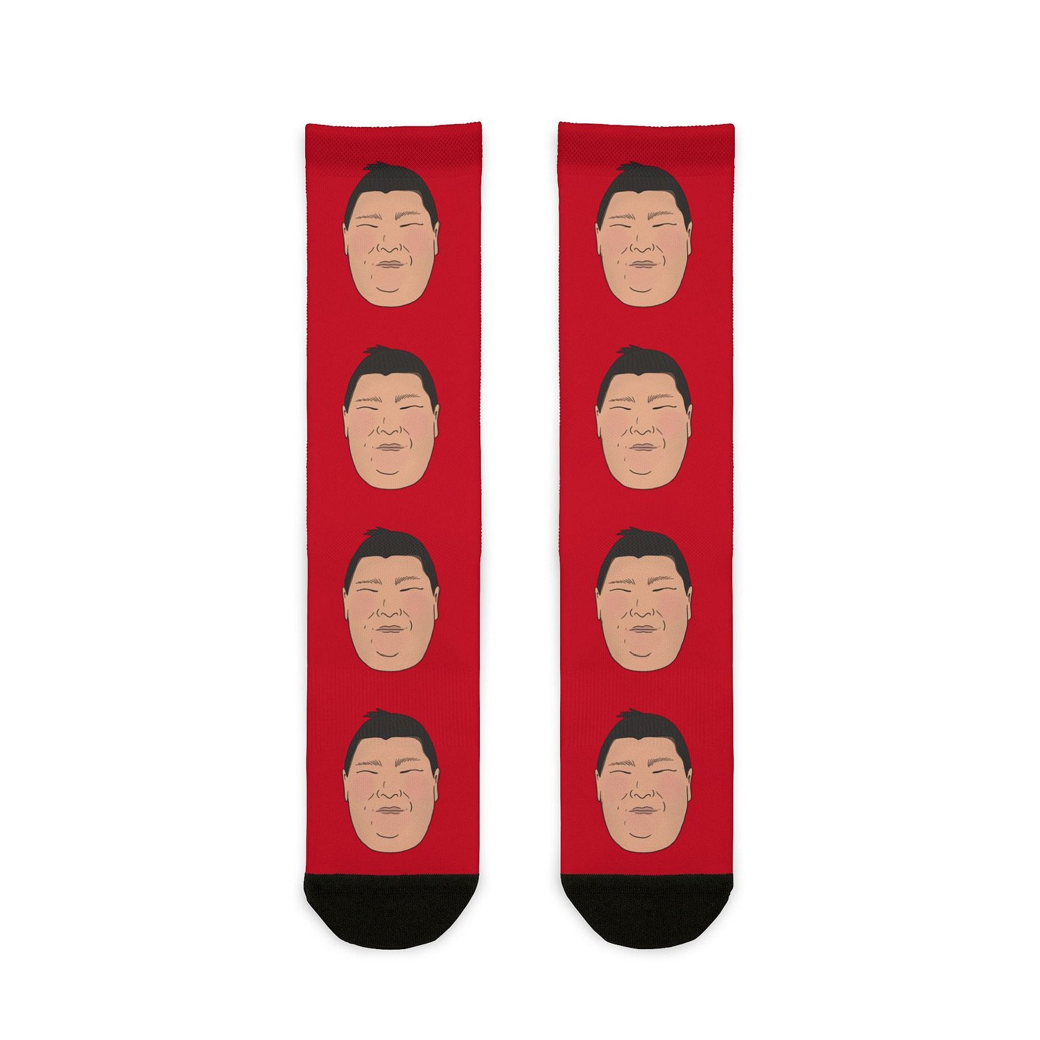 Flat lay of red Atamifuji Crew Socks with Atamifuji’s face on the front.