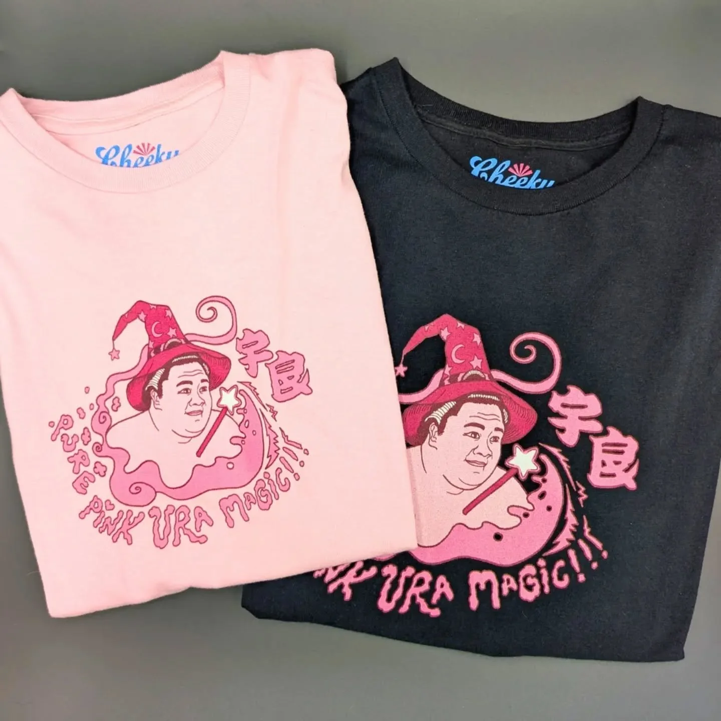 ✨ They're here! ✨

Ura Magic &amp; Aonishiki Lightning &mdash; two new designs for two of our favorite rikishi, dropping just in time for the basho.

Pure Pink Ura Magic &mdash; because Ura doesn't just win matches, he casts spells. Designed with tal