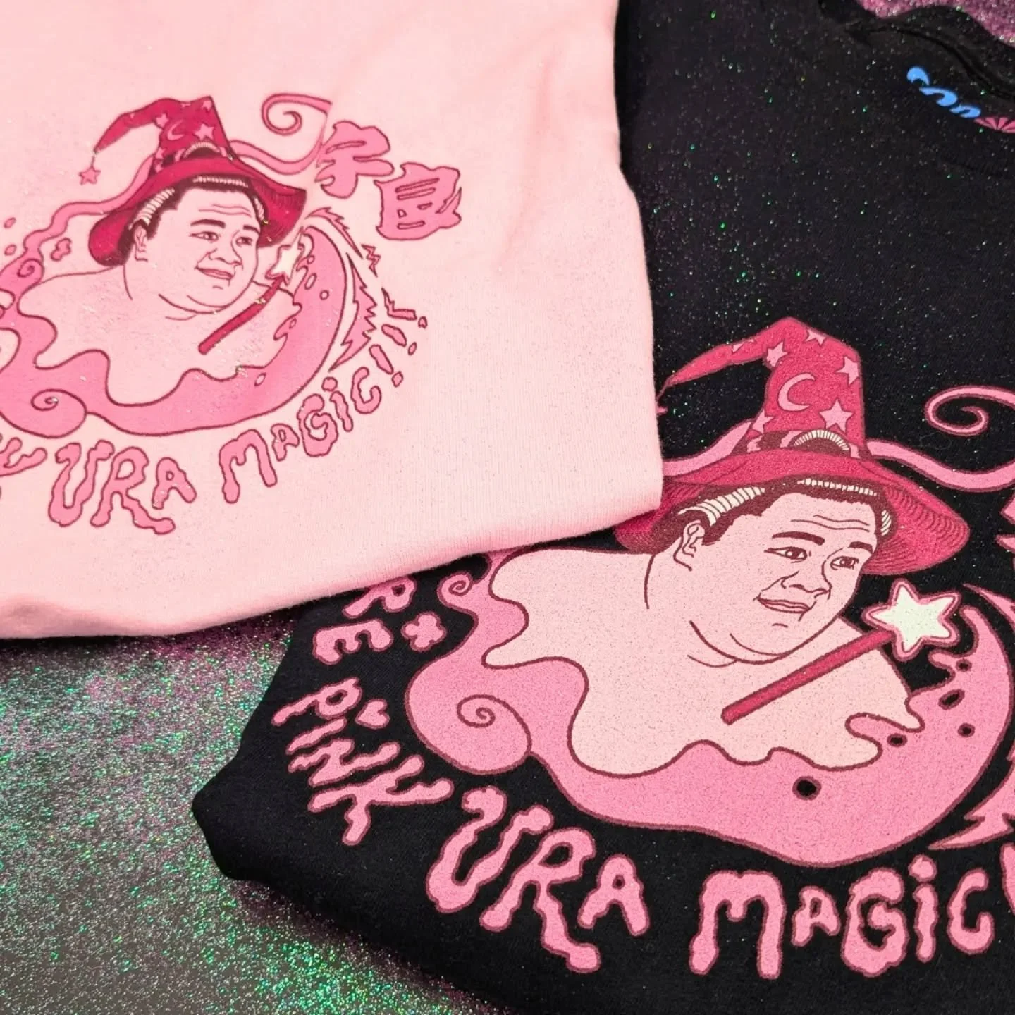 Did glitter get everywhere while taking this photo? Yes. 

No regrets. ✨

The Pure Pink Ura Magic design is available in t-shirt and hoodie! 

Shop now to wear a bit of Ura's magic. 

Cheekysumo.com 🎩🩷

#sumo #ura #cheekysumo #uramagic #pinkglitter