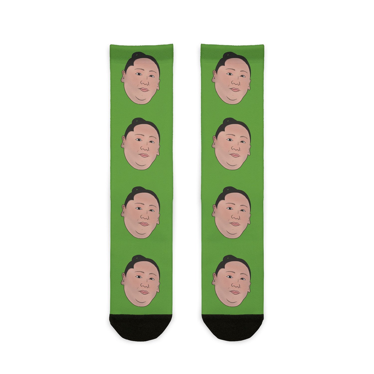 Front flat view of green socks with Wakatakakage's face down the front