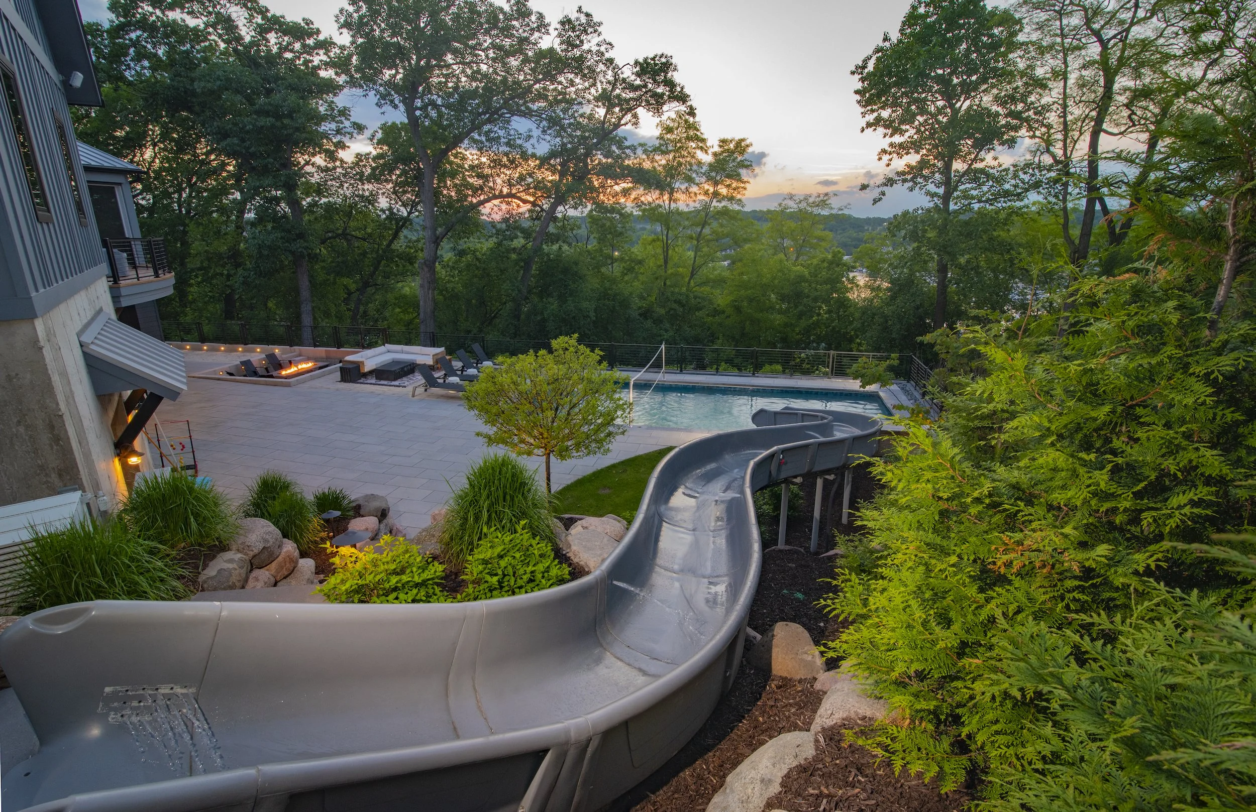 Barrington Pools custom shotcrete inground pool overlooking beautiful scenery with 250 foot water slide