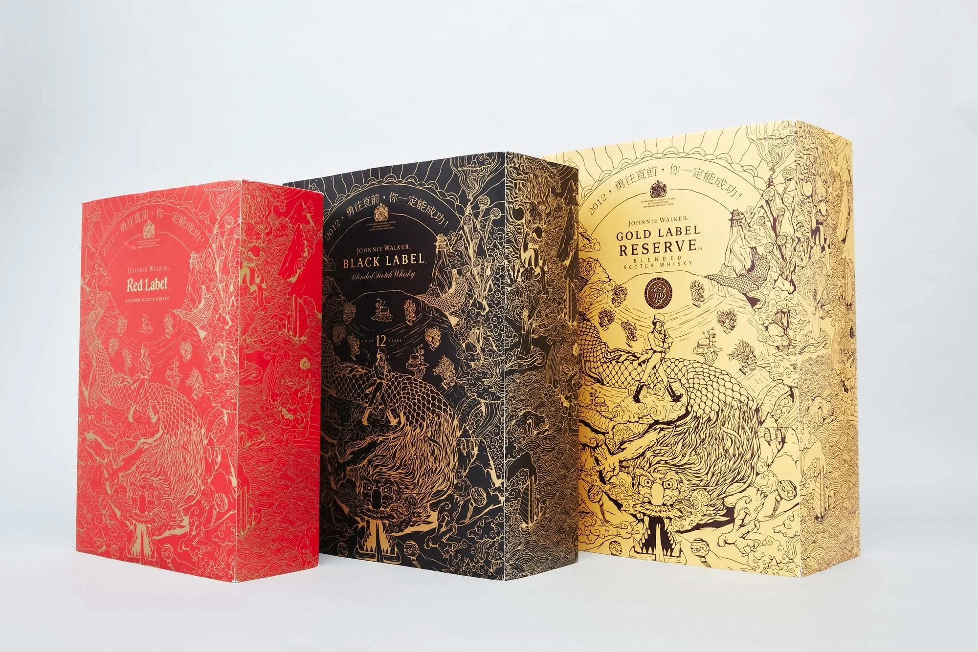 Johnnie Walker Chinese New Year limited edition gift box set illustration by Chris Martin – Red Label, Black Label and Gold Label Reserve packaging featuring dragon and mythical creature illustrations in red, black and gold, packaging for diageo
