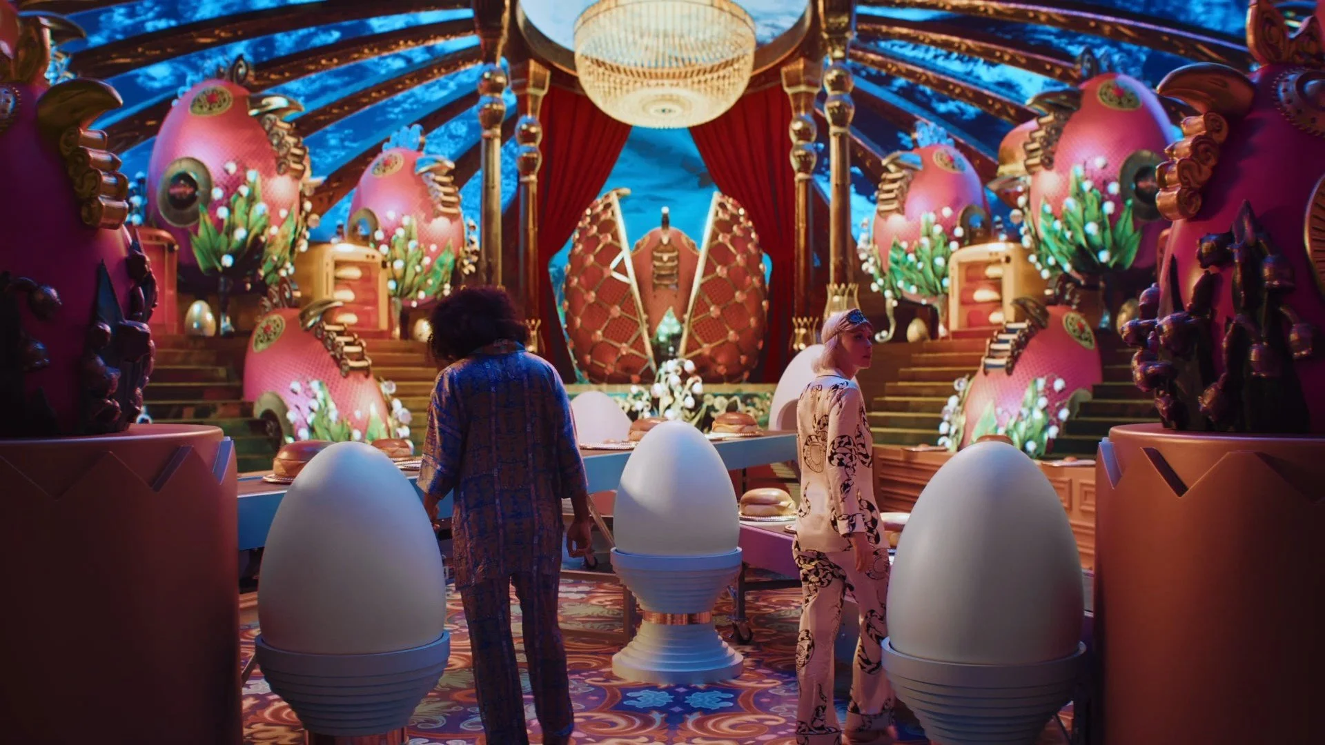 Concept set design final render by Chris Martin for Resorts World Las Vegas – surreal egg-themed performance stage with giant decorated eggs, chandelier and red curtain, created for PSYOP music video production