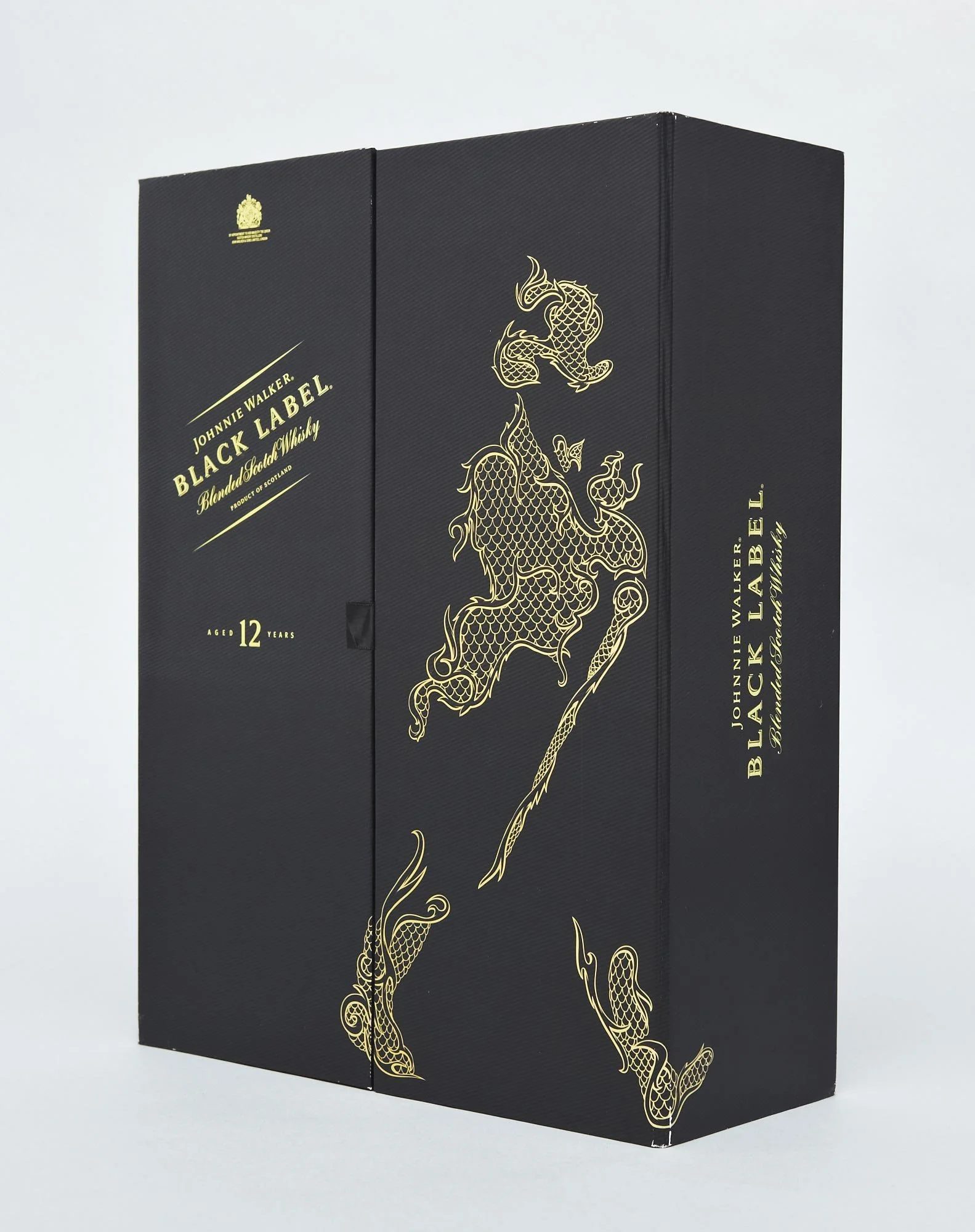 Johnnie Walker Black Label Chinese New Year gift box illustration by Chris Martin – black and gold packaging featuring dragon Striding Man motif, luxury spirits packaging design for Diageo