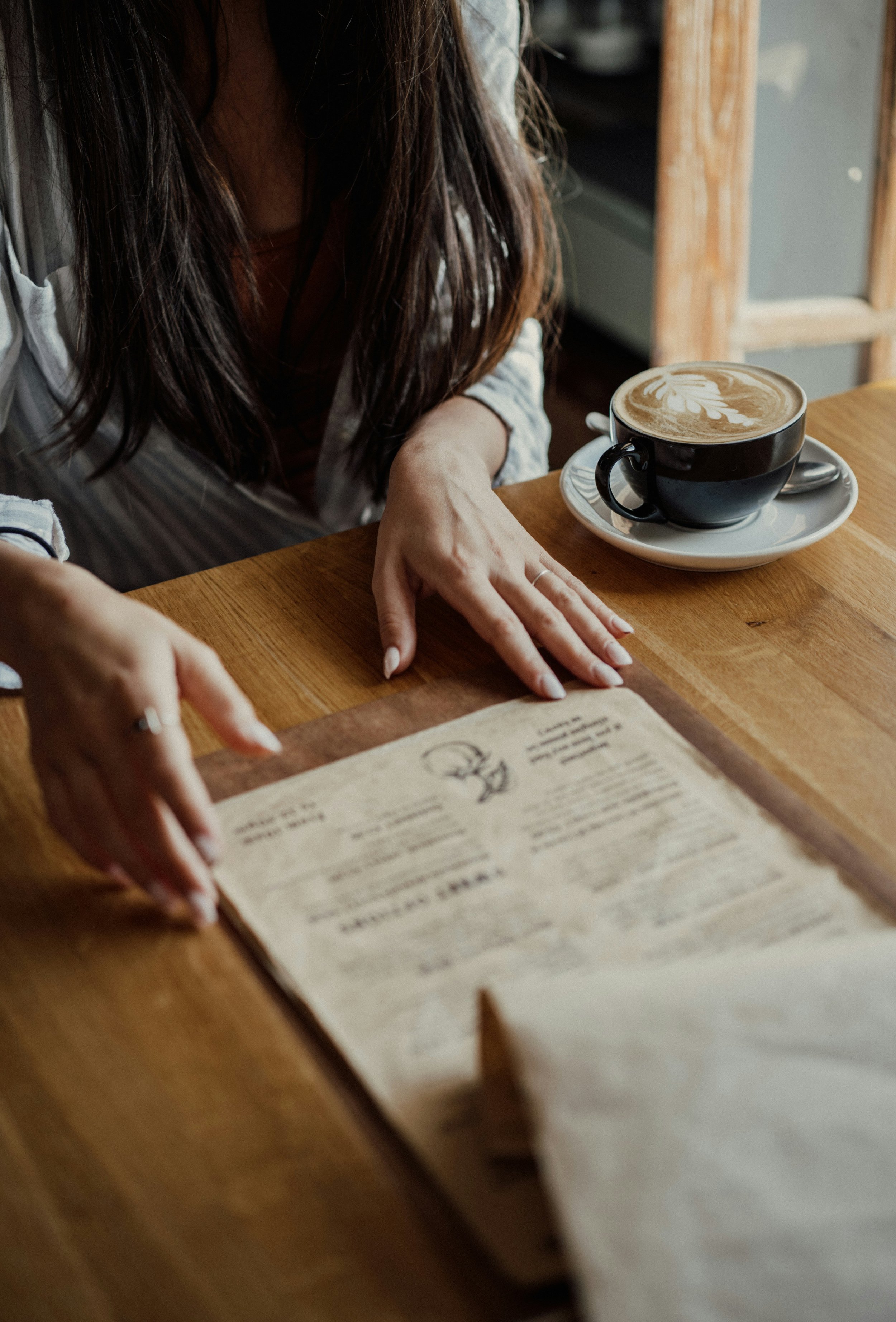 Printed menu, showcasing professional layout and branding done at Scotch and Tell Studio.