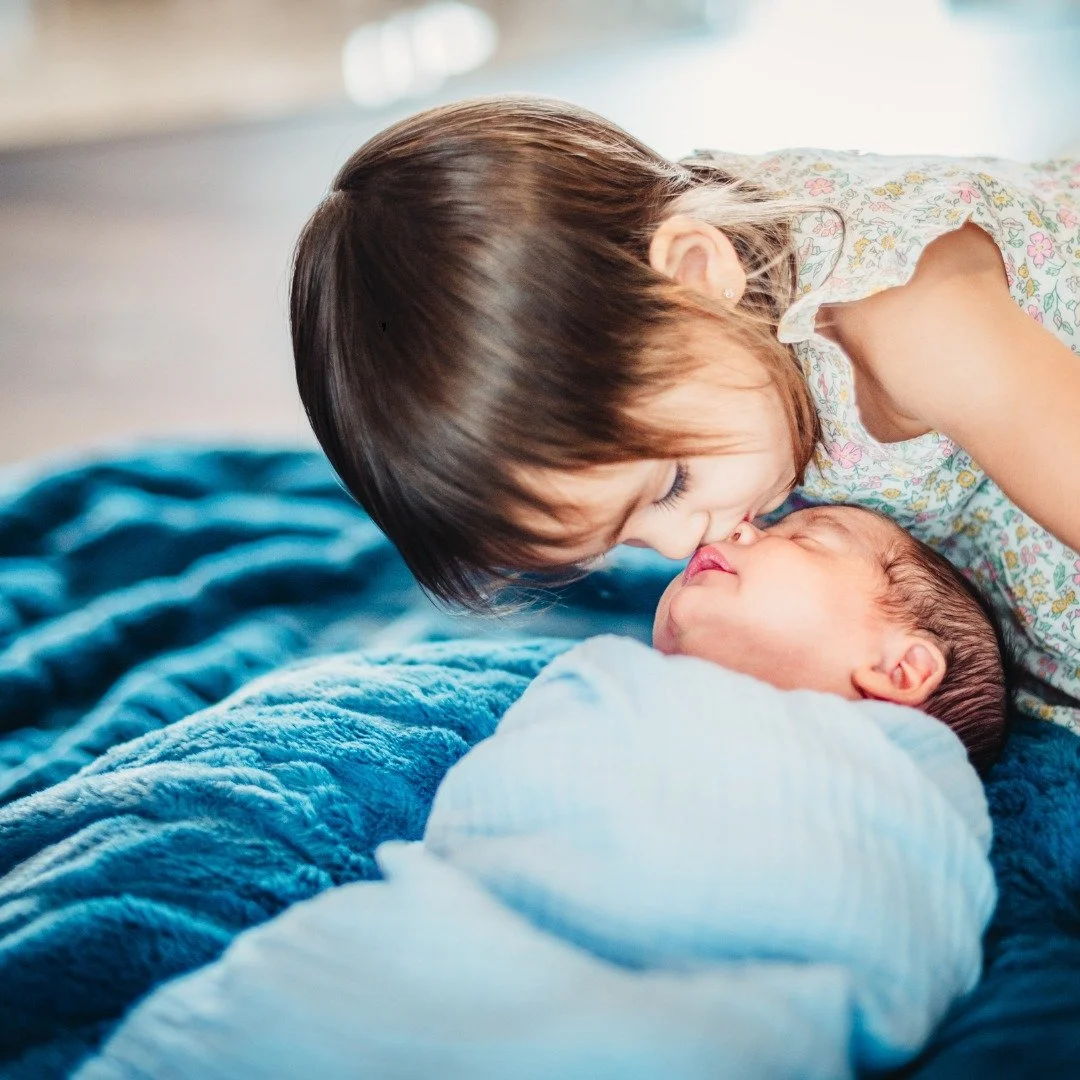 "What if my older child doesn't like the baby?"

The truth is, introducing a new baby doesn't always look like the photos.

Some children are desperate to cuddle the baby. Some barely acknowledge them. Some are fascinated one minute and ask