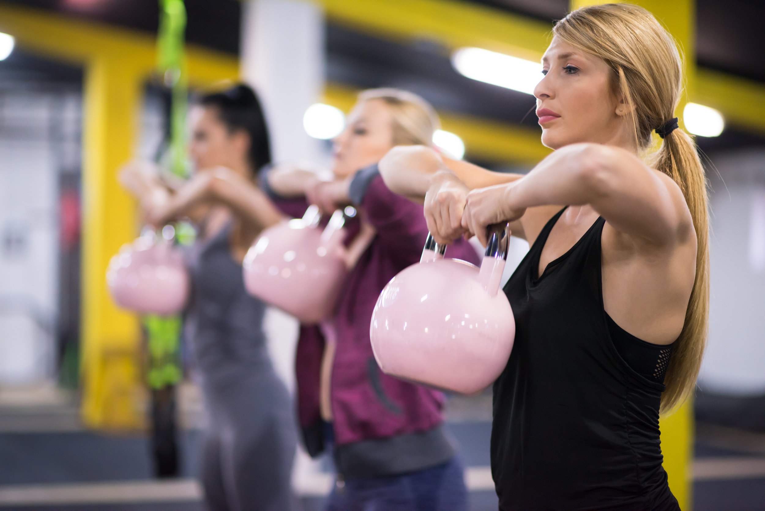 athletes-doing-exercises-with-kettlebells-2023-11-27-05-12-37-utc.jpg
