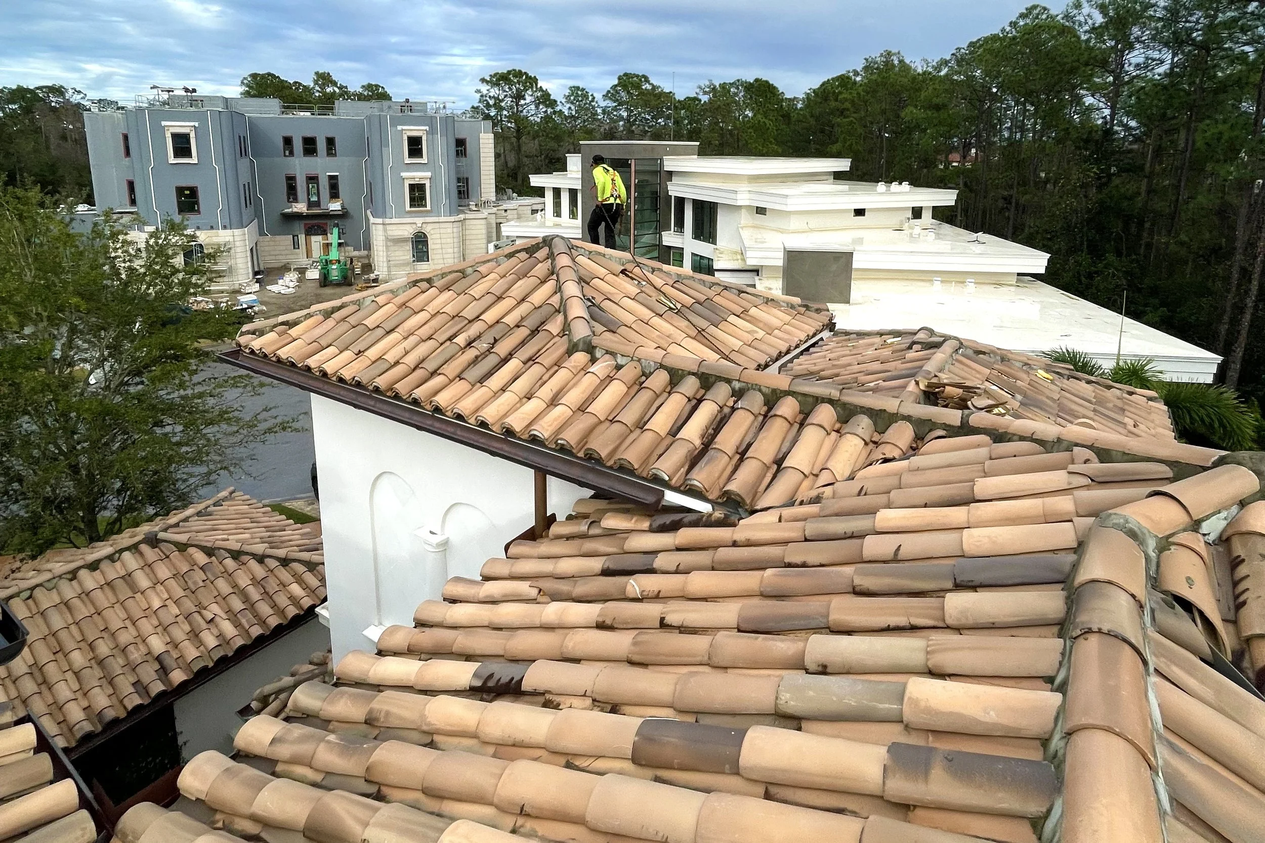 northmen roofing cap and pan tile roof repairs in Golden Oak FL