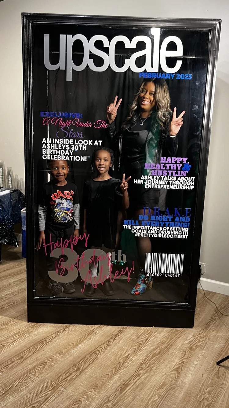 Family posing on an Upscale magazine booth cover