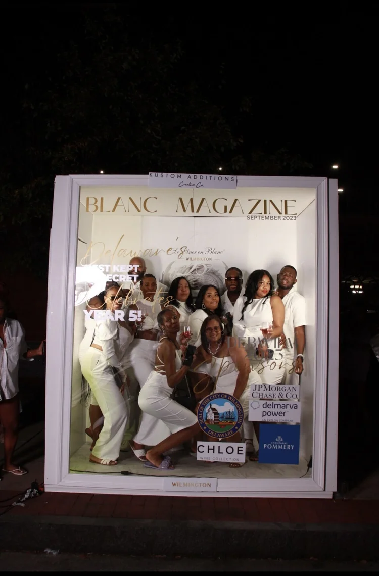 Group of women posing in the Deluxe Magazine Booth