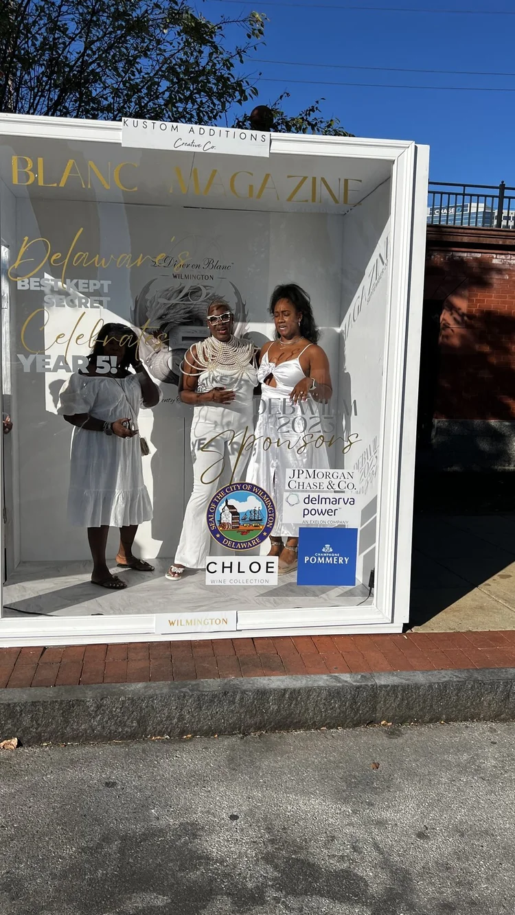 Daytime view of the Deluxe Magazine Booth at a Wilmington street activation