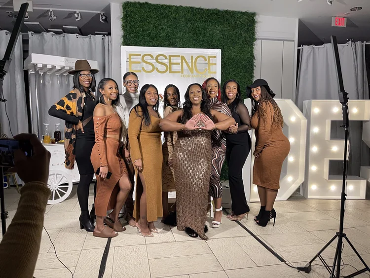 Guests gathered around the Essence magazine booth