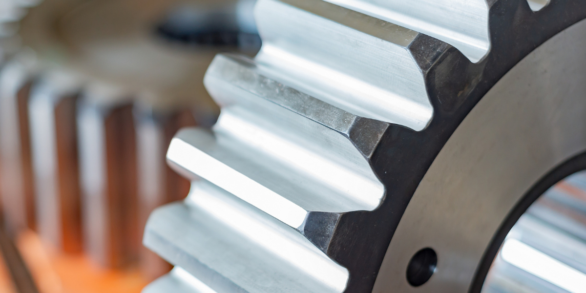 Precision machined metal component being evaluated for fit and accuracy