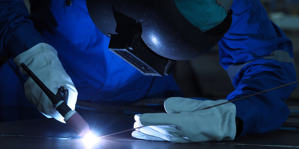 Metal worker TIG welding