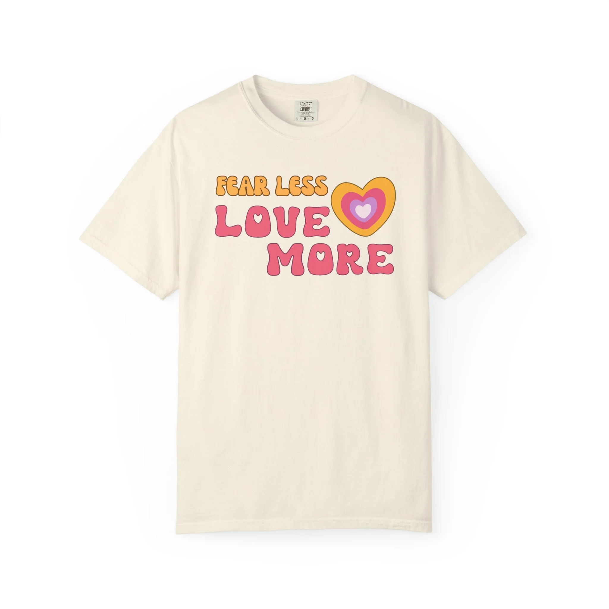 Comfort colors graphic T-shirt with retro font that says live more fearless and graphic of retro style heart