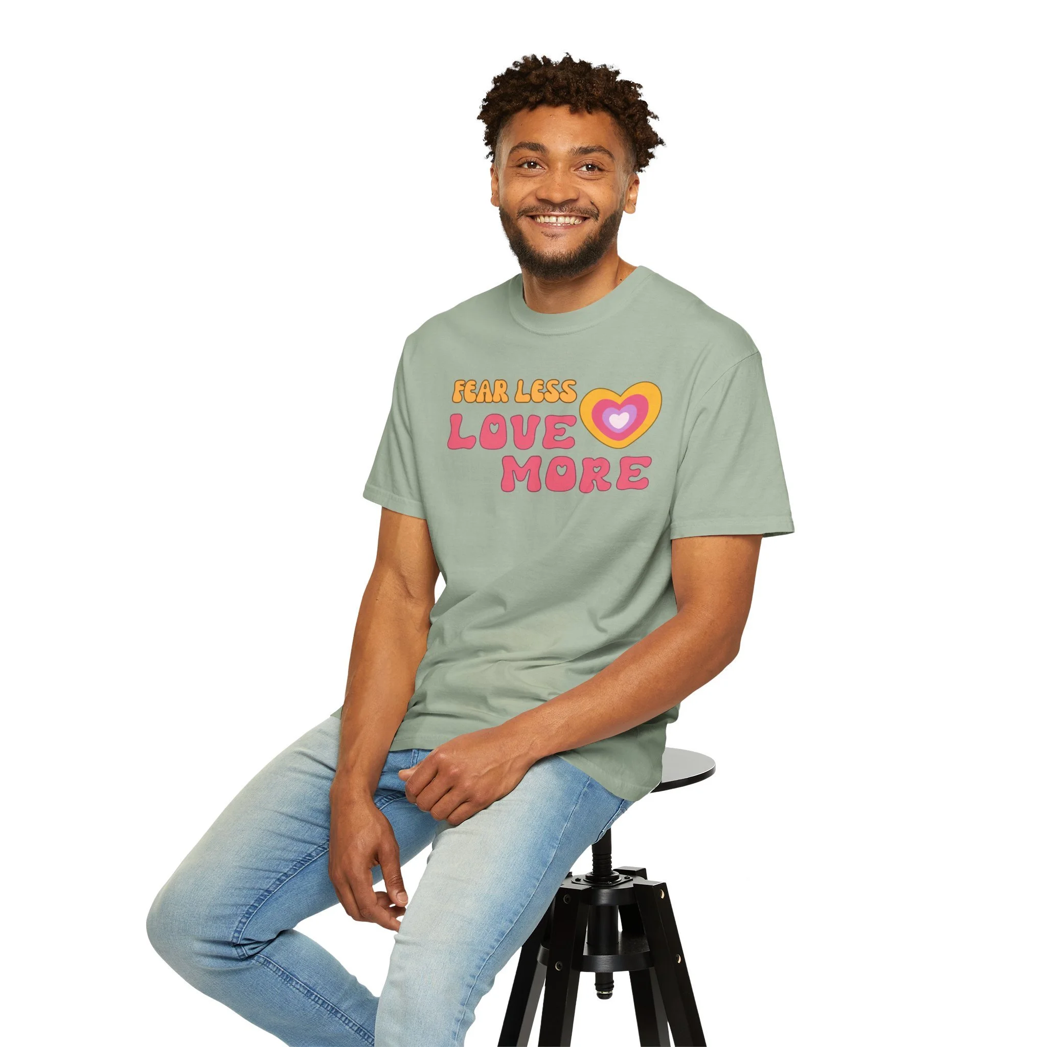 Comfort colors graphic T-shirt with retro font that says live more fearless and graphic of retro style heart