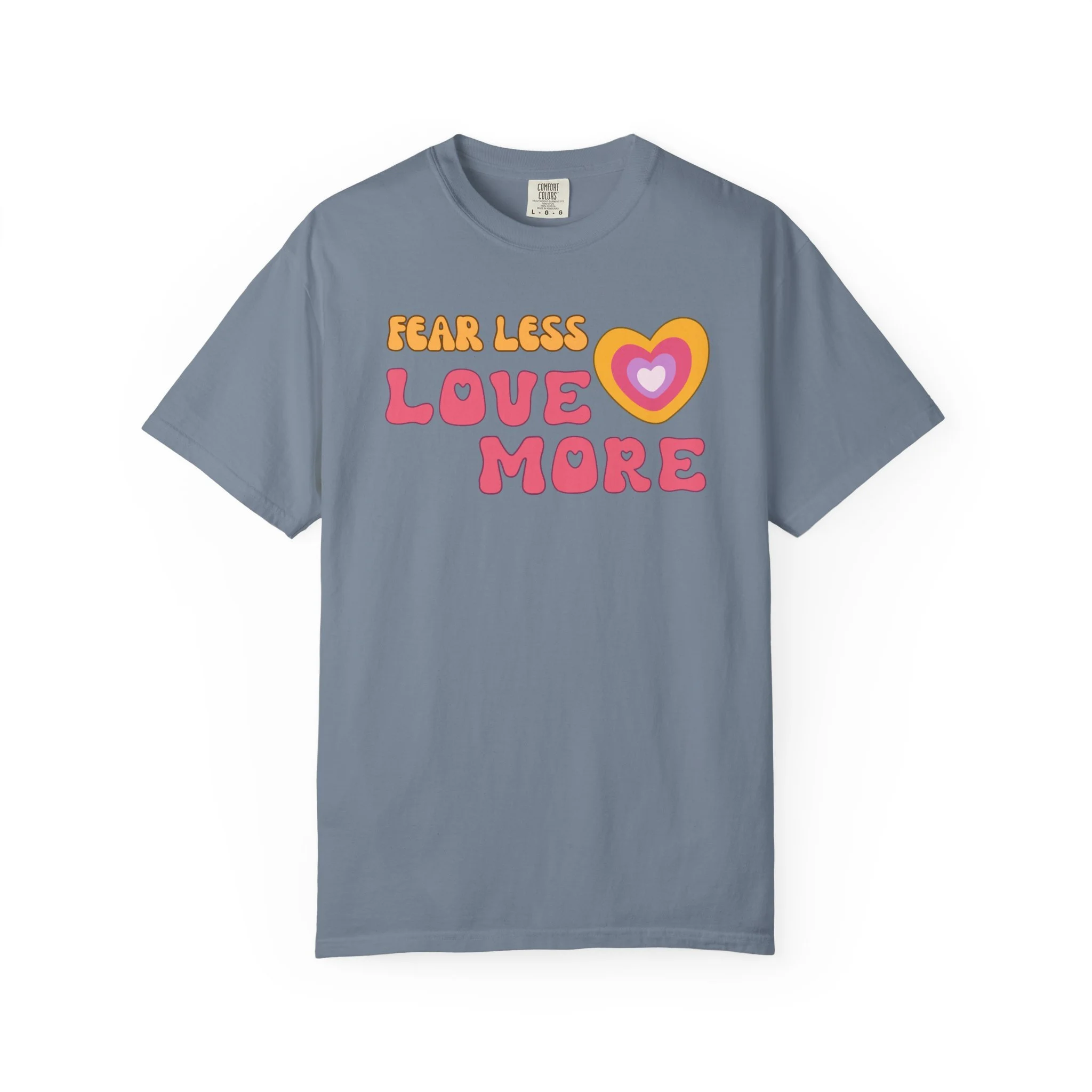 =Comfort colors graphic T-shirt with retro font that says live more fearless and graphic of retro style heart