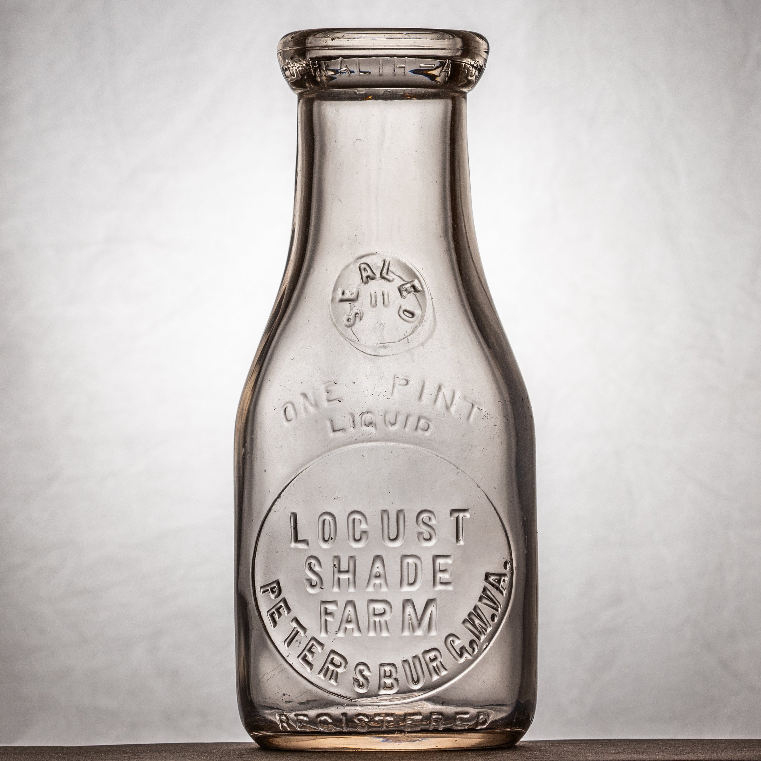 Locust Shade Farm, Petersburg milk bottle. Pint, round, embosed.