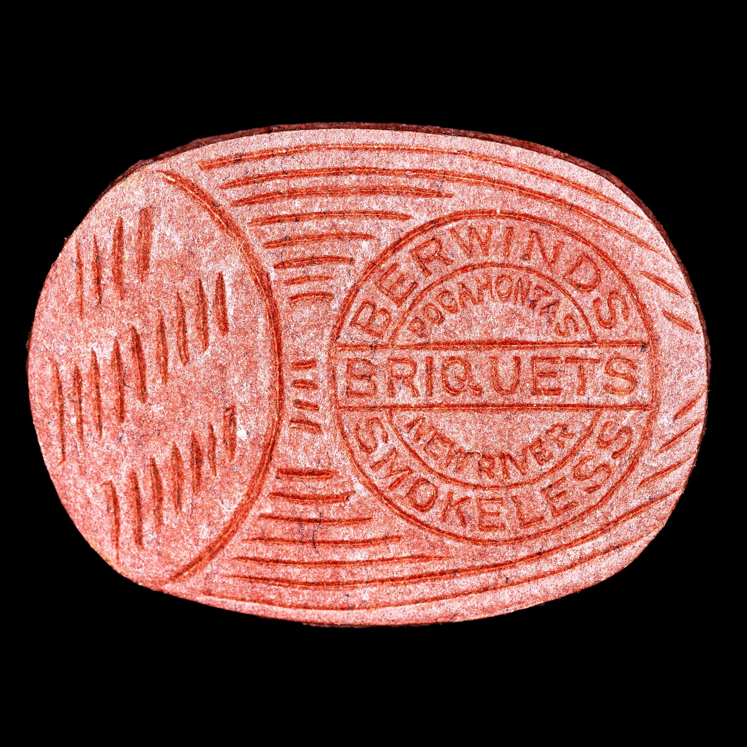 An advertising piece included in briquets of coal by the Berwind branch of the New River & Pocahontas Coal Company.