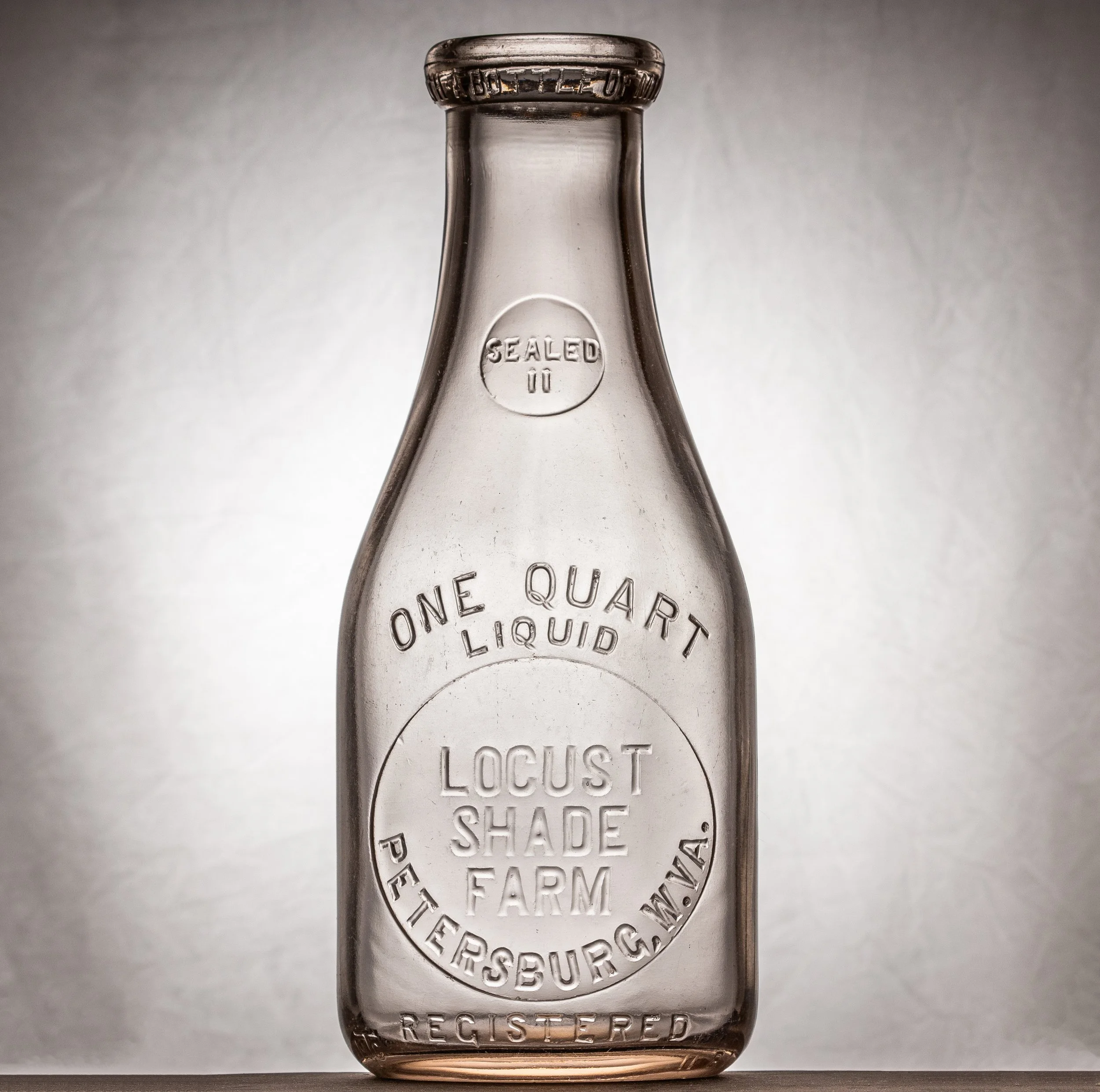 Locust Shade Farm, Petersburg milk bottle. Quart, round, embosed.