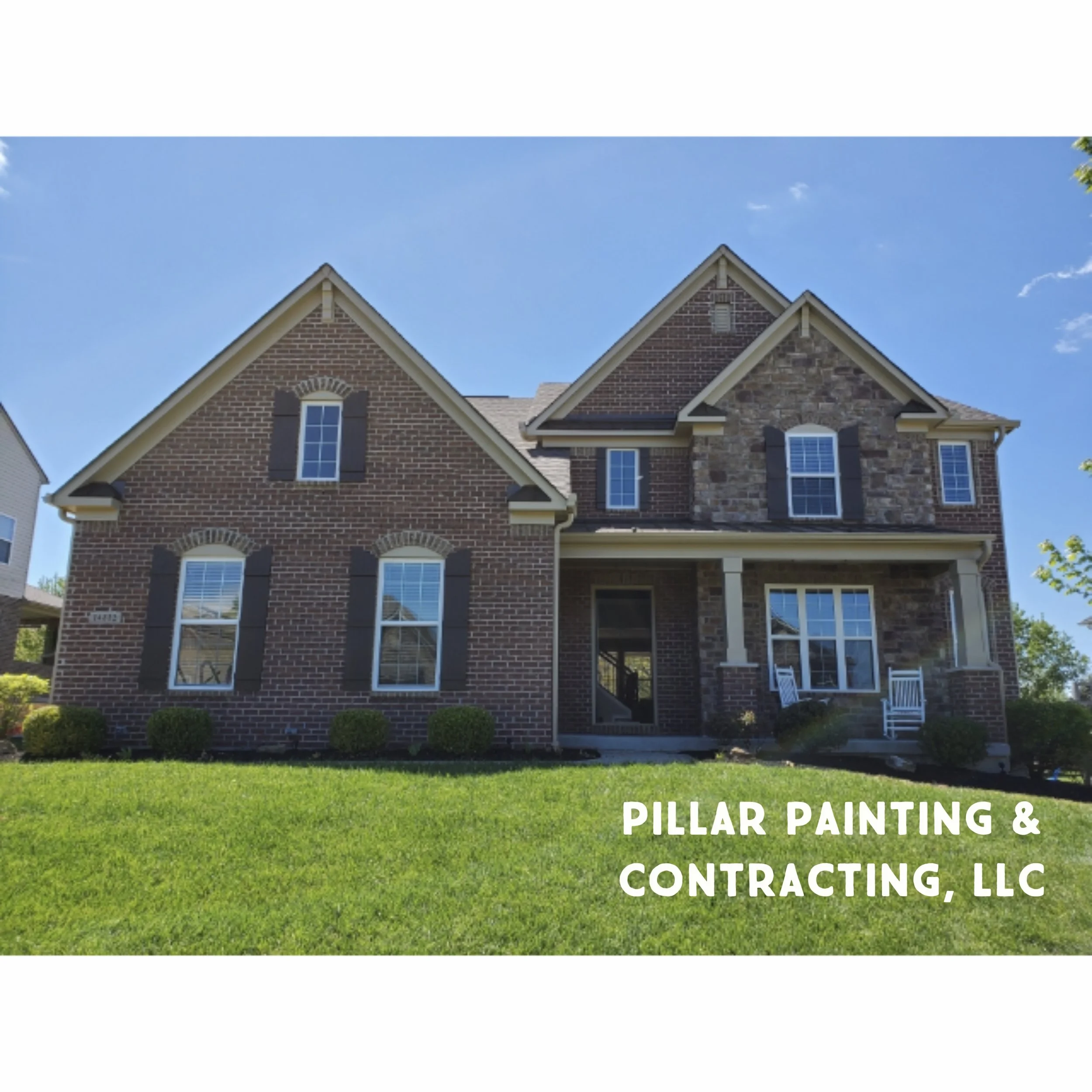 Photo of a brick residential house with multiple steep gable roofs and white-framed windows, under a blue sky with a few clouds, with green lawn and installed white outdoor furniture. The text overlay reads 'Pillar Painting & Contracting, LLC'.