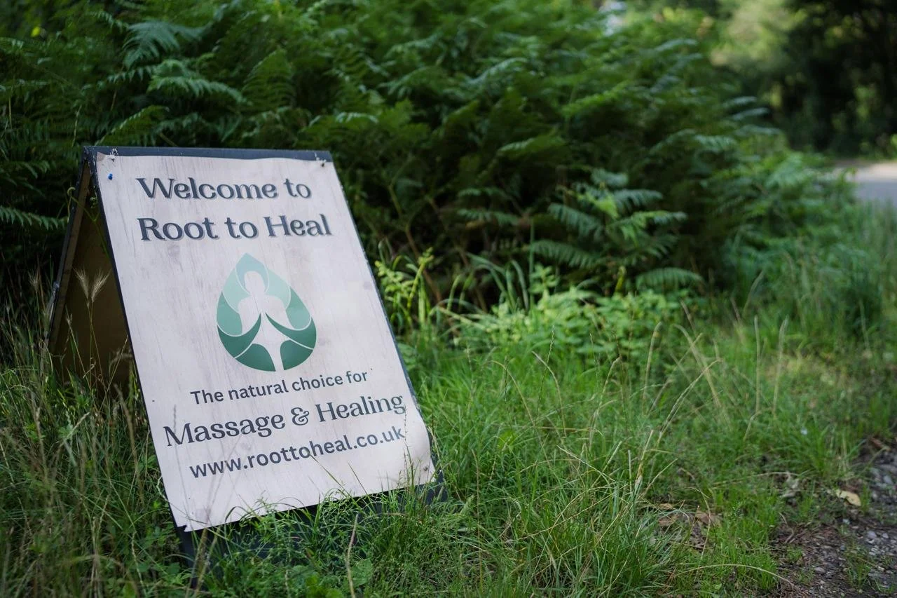 Root to heal entrance sign. Healing business, holistic healing