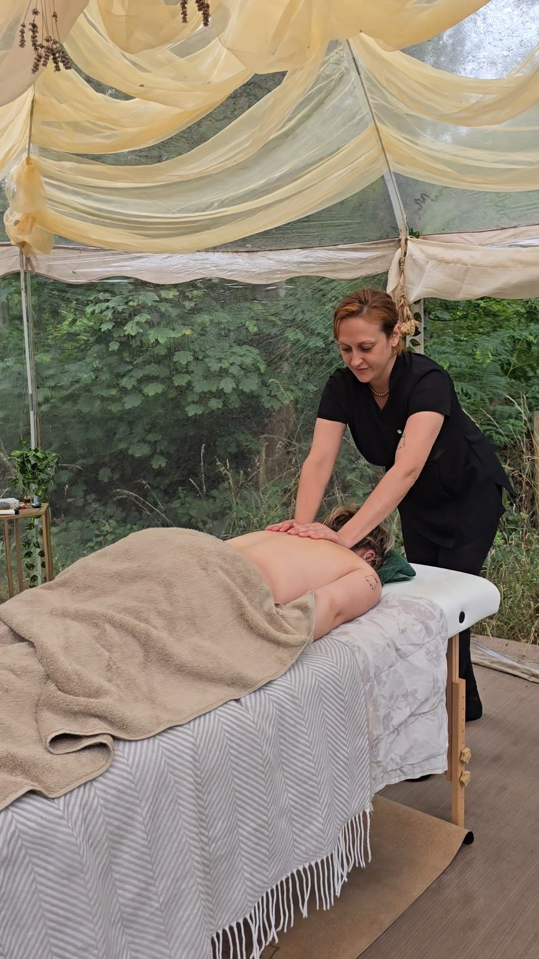Massage therapist providing relaxing massage treatment in Suffolk, Deep tissue and holistic massage treatment at Root to Heal.