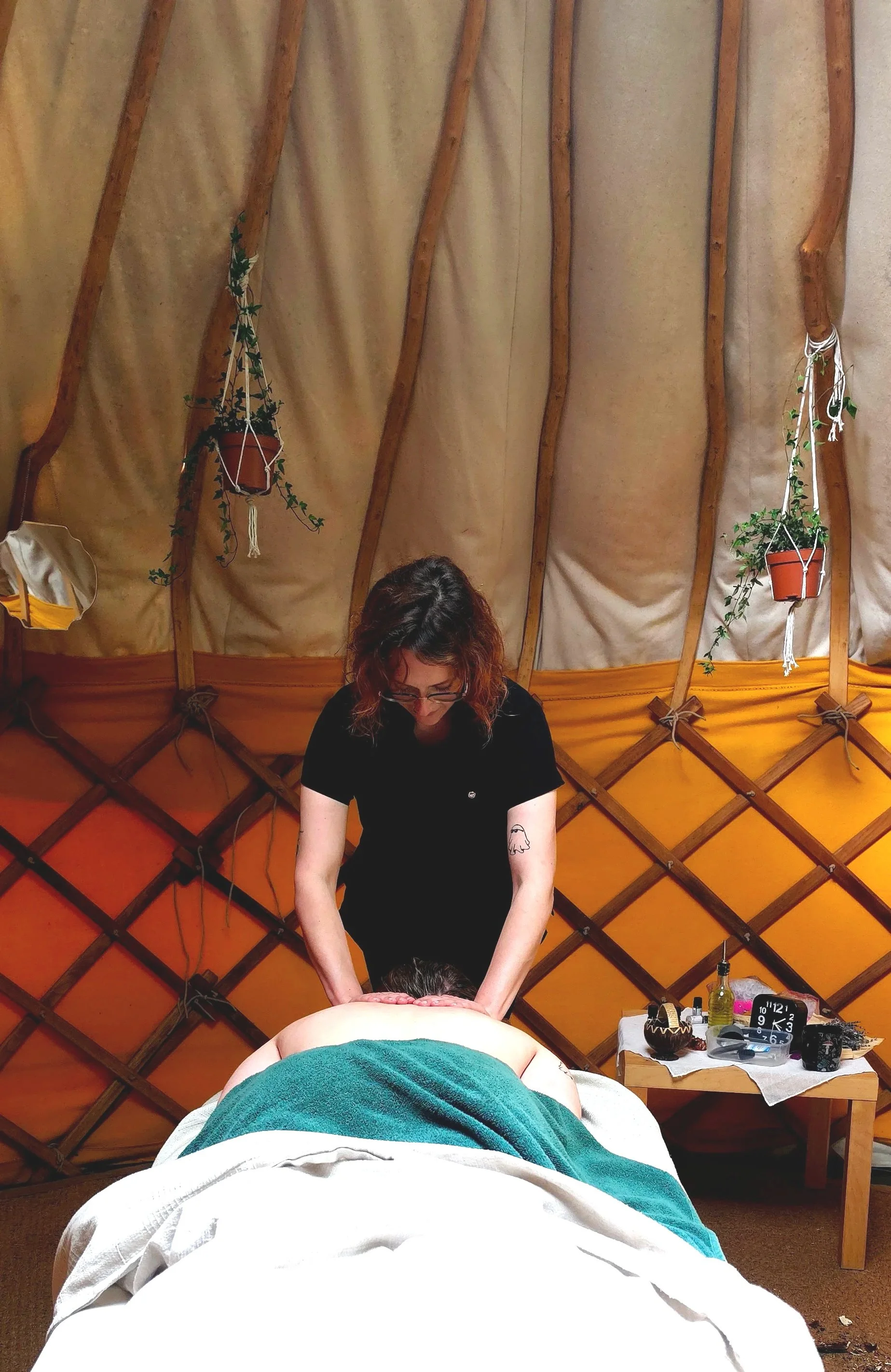 Massage therapist providing relaxing massage treatment in Suffolk, Deep tissue and holistic massage treatment at Root to Heal
