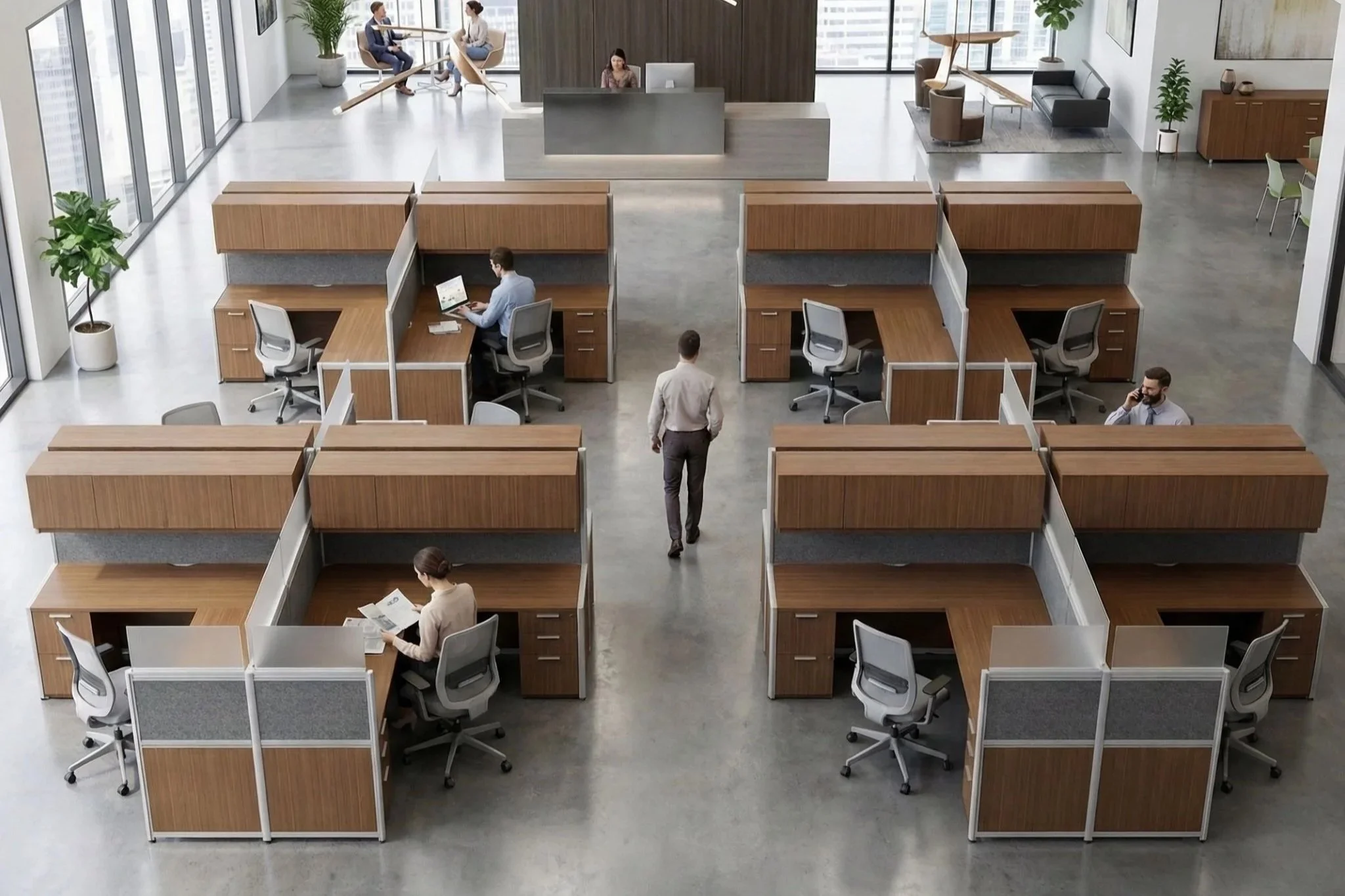 An aerial view of a modern office reception area and coworking space with several people working at desks and conversing, featuring large windows, indoor plants, and a reception desk in the center.