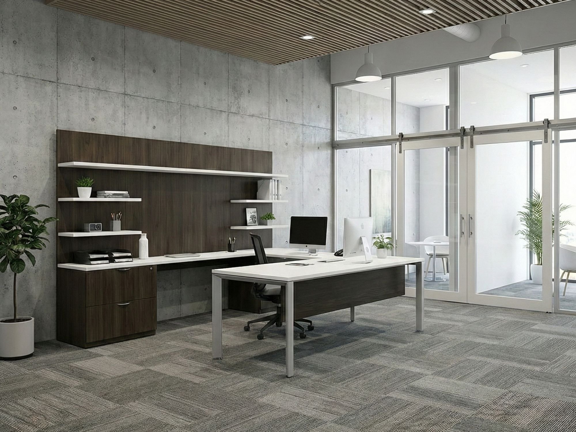 Modern office space with concrete walls, glass sliding doors, ceiling lights, white desks, black chairs, and indoor plants.
