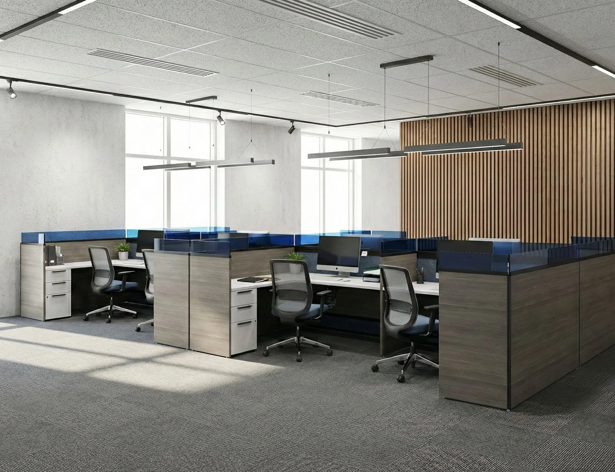 Modern office space with workstations, chairs, laptops, a small round table, large windows with city view, and framed black-and-white buildings photos on wooden wall.