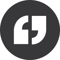 A dark gray icon with quotation marks inside a circle.