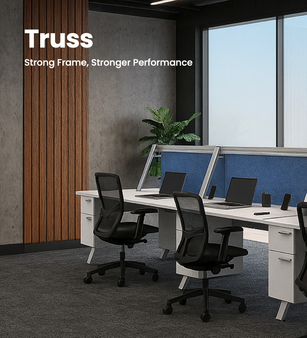 An office workspace with a row of desks, black office chairs, laptops, and a large window. The wall features a wooden panel and a potted plant. The image text reads: "Truss Strong Frame, Stronger Performance."
