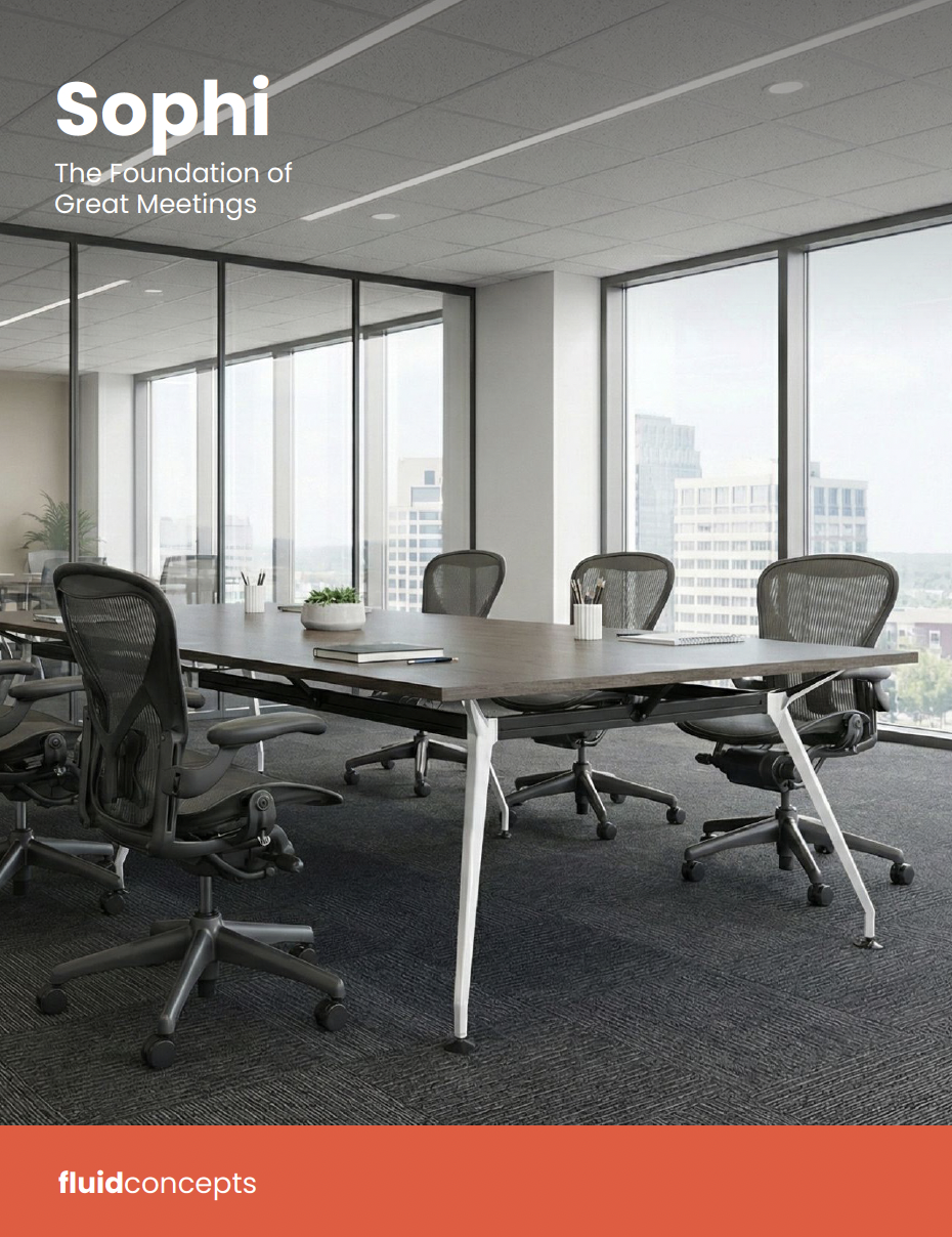 Modern conference room in a high-rise office building with large windows, a long wooden table, black ergonomic office chairs, and city view outside.