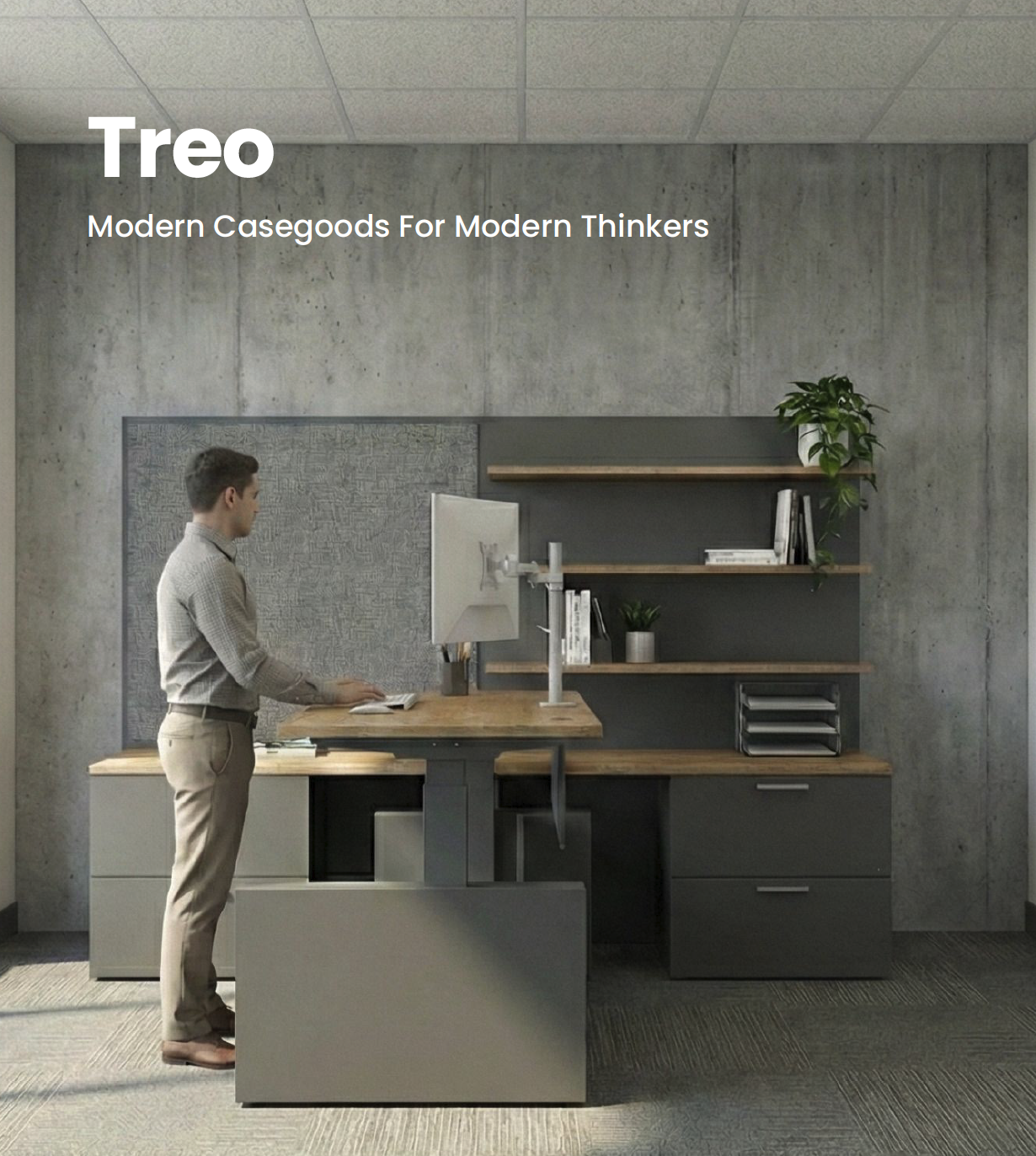 A person standing at a modern office desk with a monitor, in a room with concrete walls and wooden shelves with books and plants.